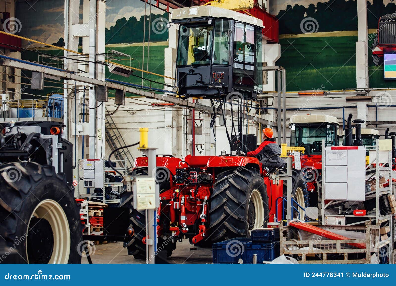 Industrial Workers Assembles Agricultural Tractor in Stock