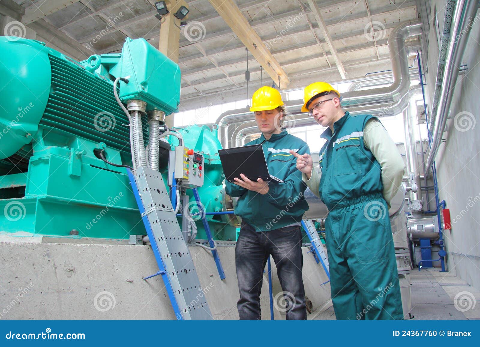 industrial workers with notebook