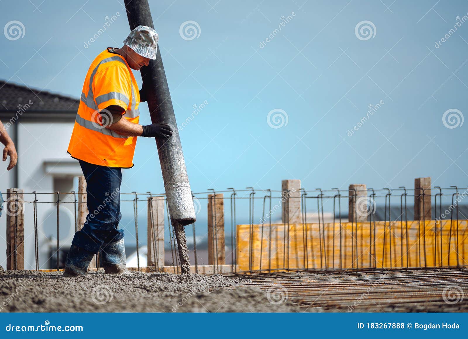 Workers Pouring Cement with Automatic Pump Tube Stock Photo Image of