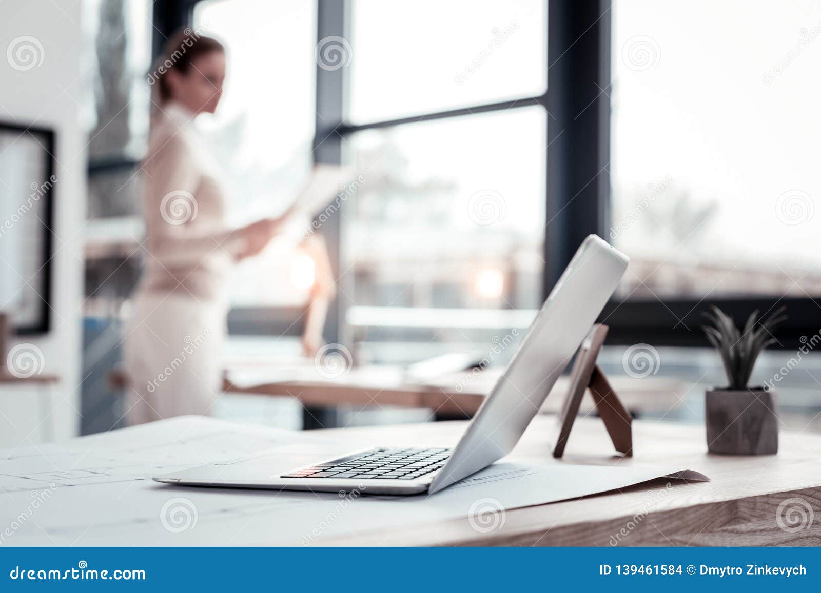 industrious clever businesswoman heading to her laptop having new idea
