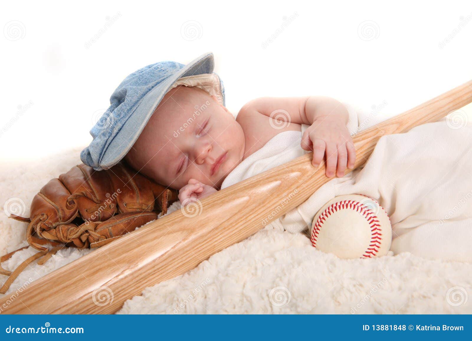 Infant Boy Holding Baseball Bat and Sleeping on a Stock Photo Image