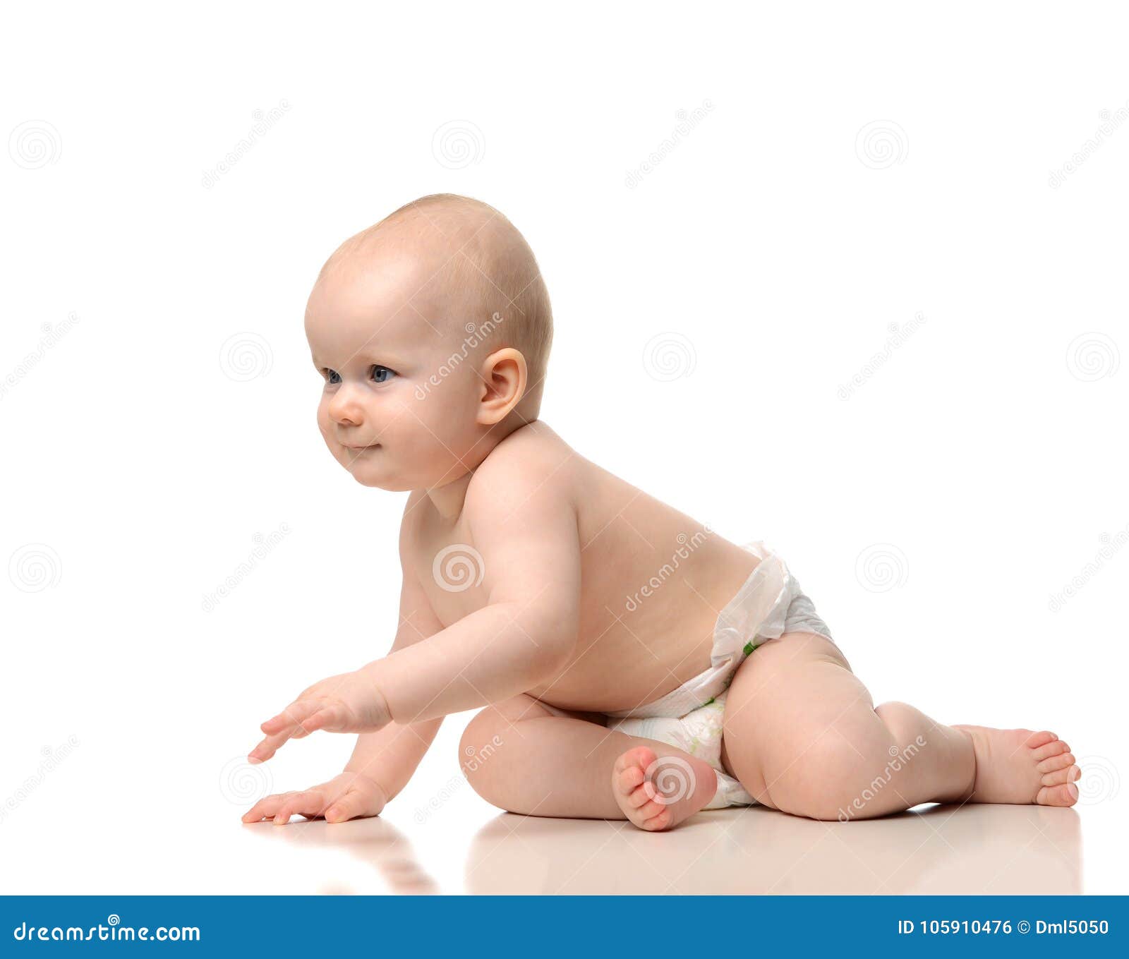 infant child baby girl crawling and happy looking at the corner