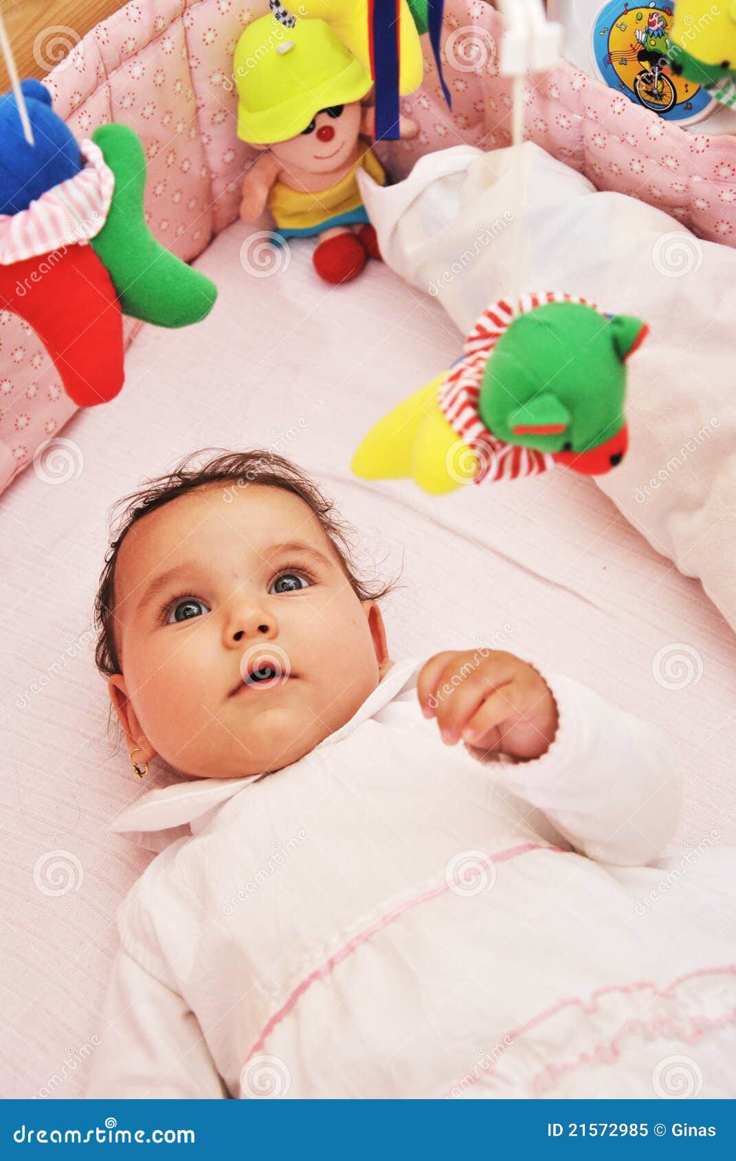 Infant in crib with toys stock image. Image of adorable 21572985