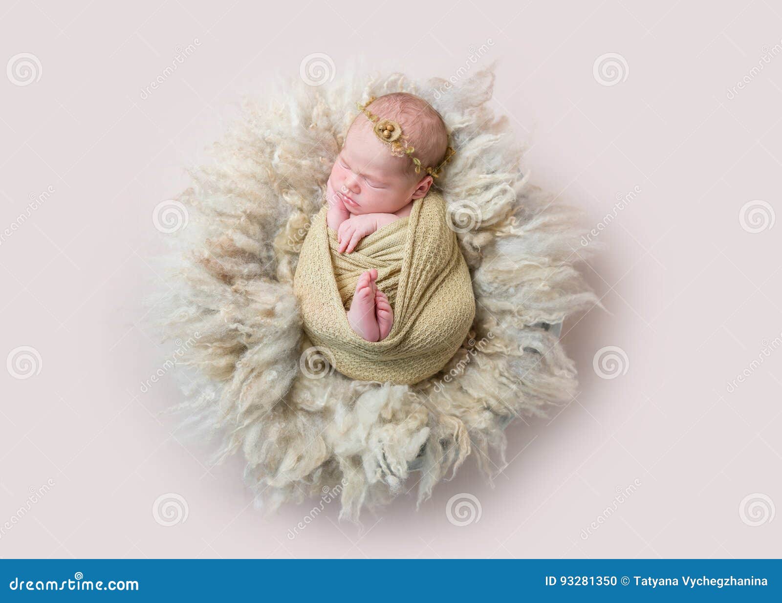 infant sleeping swaddled with rabbit toy, topview