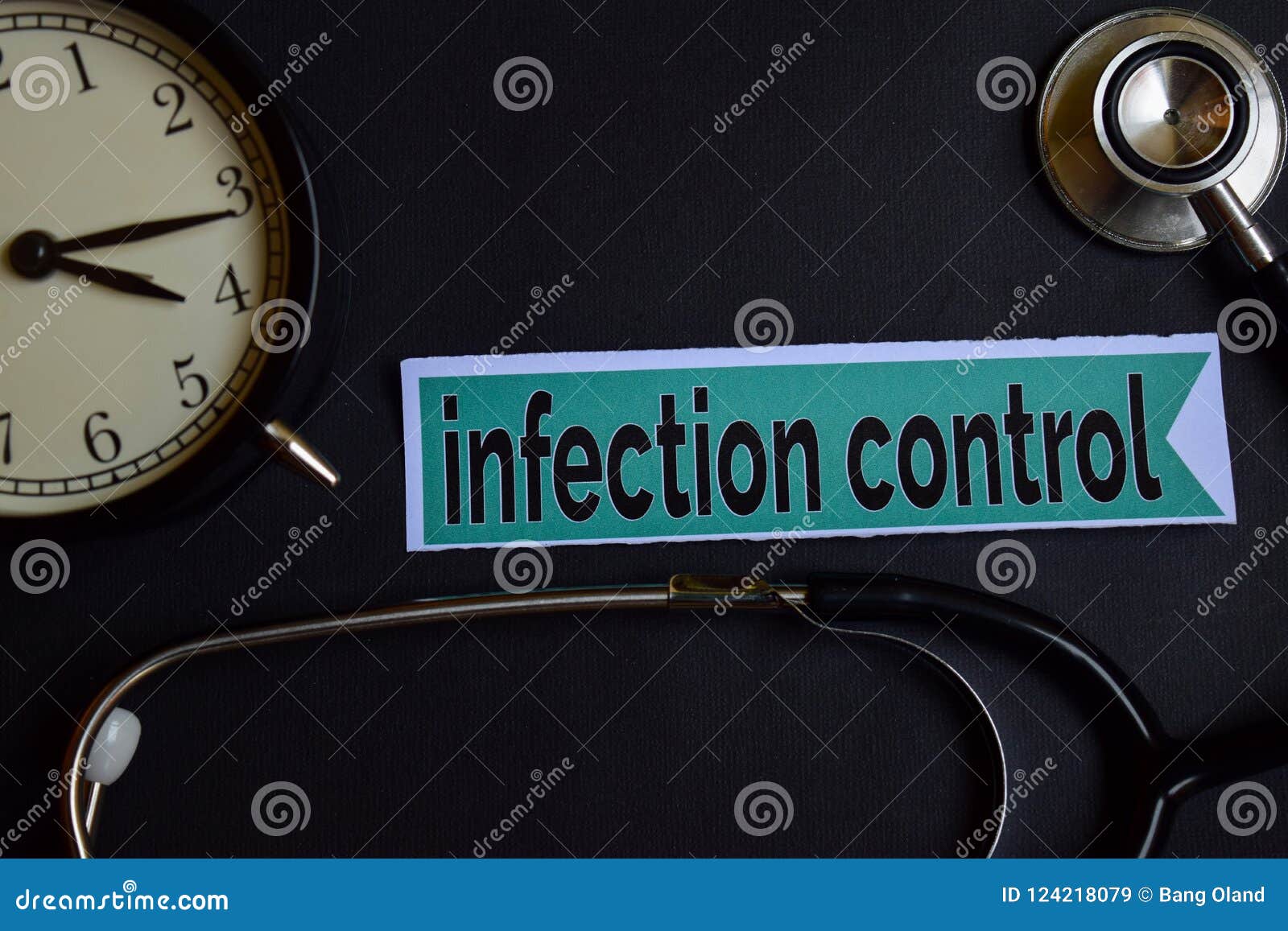 infection control on the print paper with healthcare concept inspiration. alarm clock, black stethoscope.