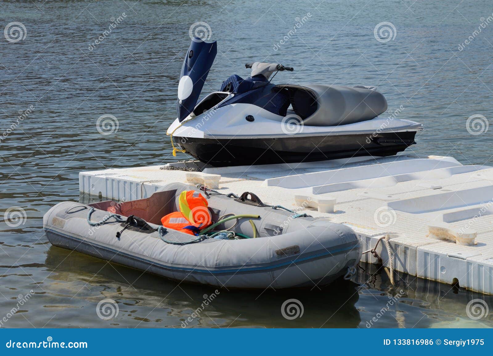 Inflatable Boat and Jet Ski on the Dock Stock Photo Image of pier