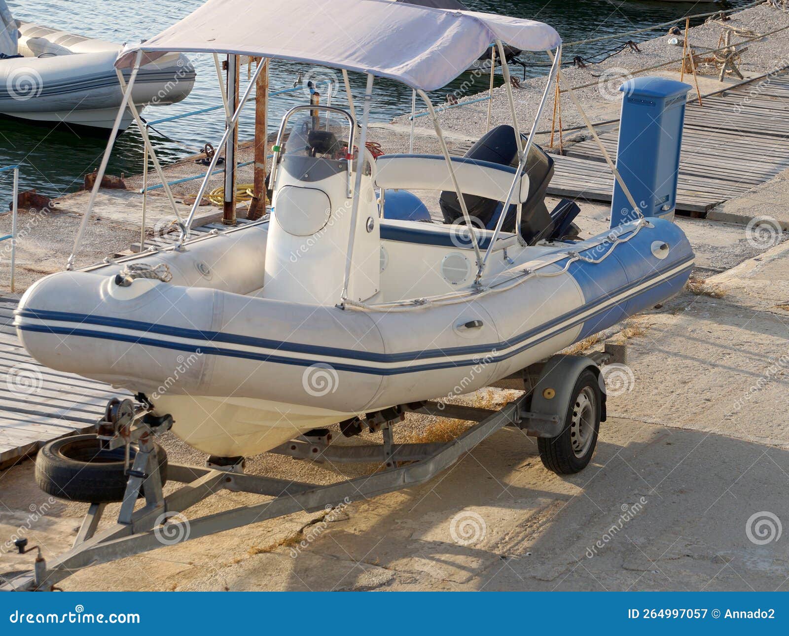 Inflatable Boat with a Motor on a Car Trailer on the Pier Stock Image
