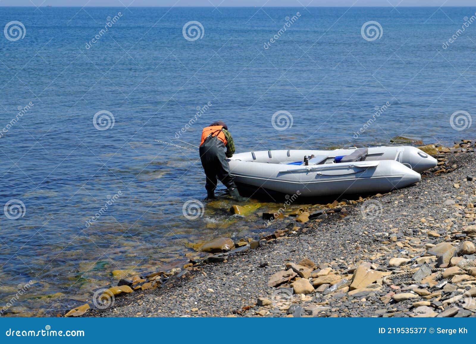 An Inflatable Rubber Fishing Boat on a Rocky Ocean Shore is Getting Ready  To Go Out To Sea for Fishing Editorial Photography - Image of inflatable,  rubber: 219535377