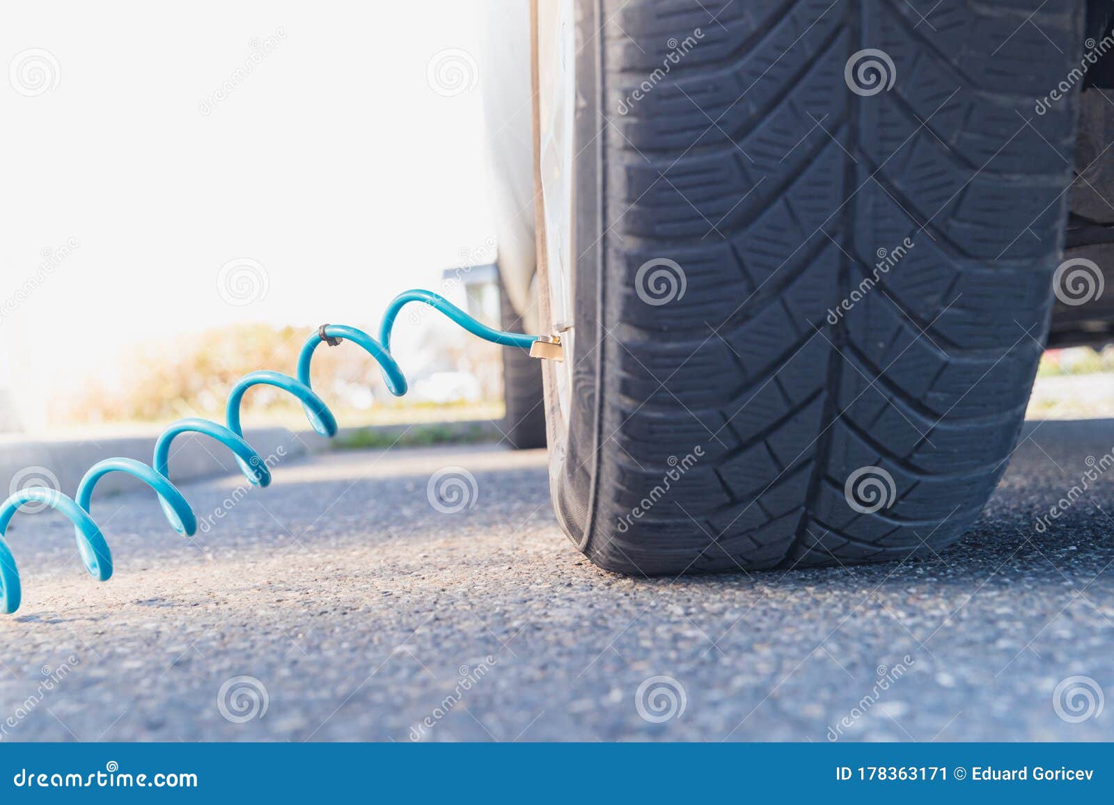 Inflating the Car Tires with Air Using a Compressor Stock Image Image