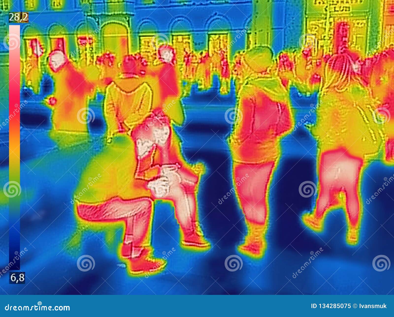 infrared thermal image of people at the city railway station on a cold winter day