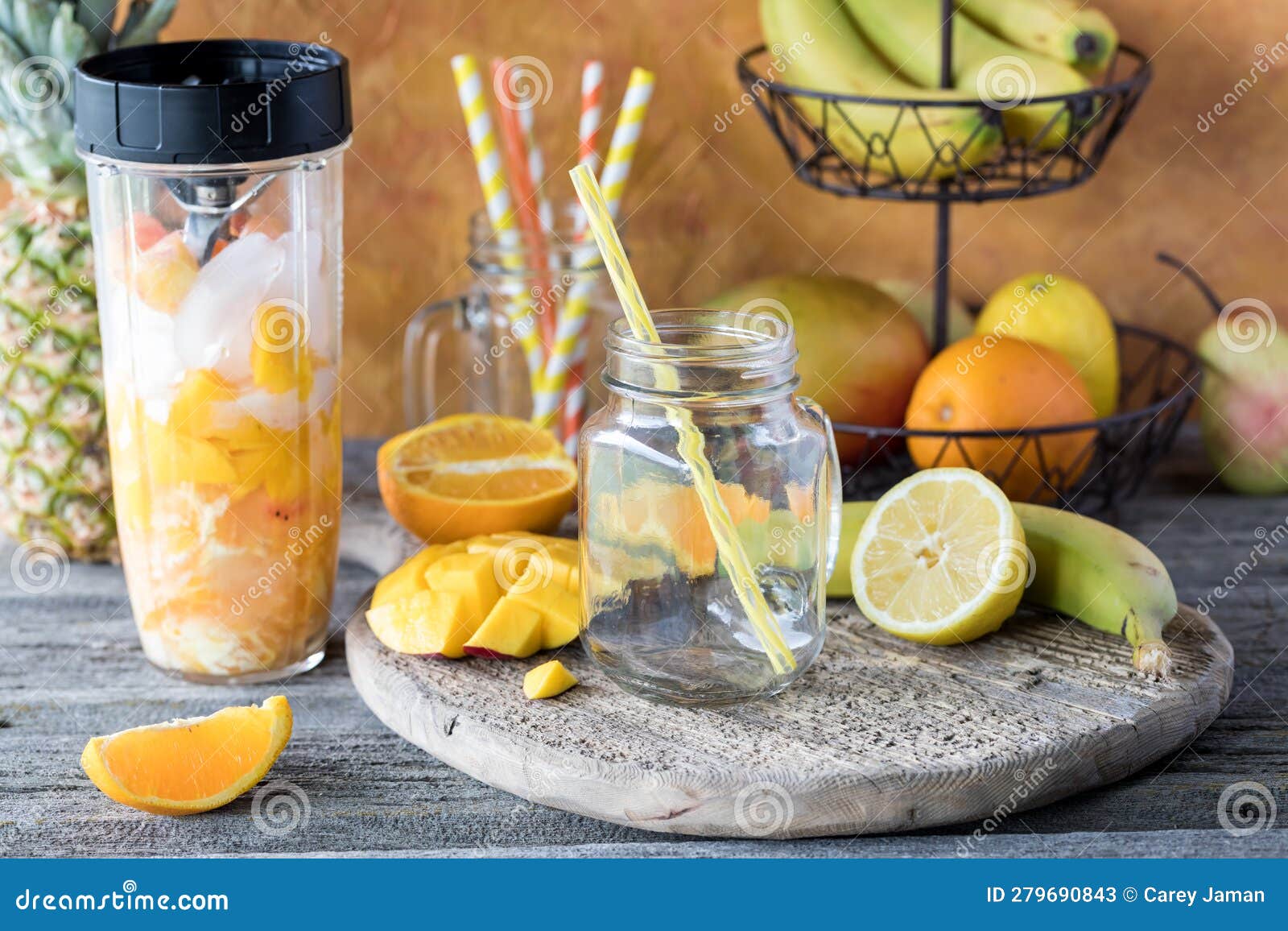Ingredients of a Mango Citrus Smoothie in a Blender Container Ready for