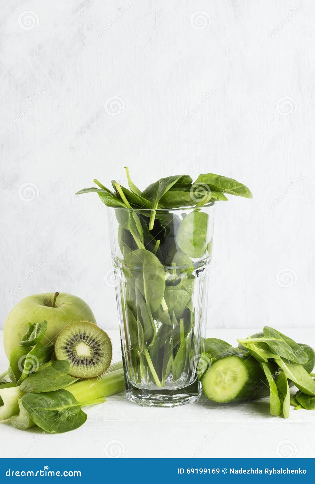 Ingredients for Smoothie Spinach, Kiwi, Apple, Celery on a Whit Stock