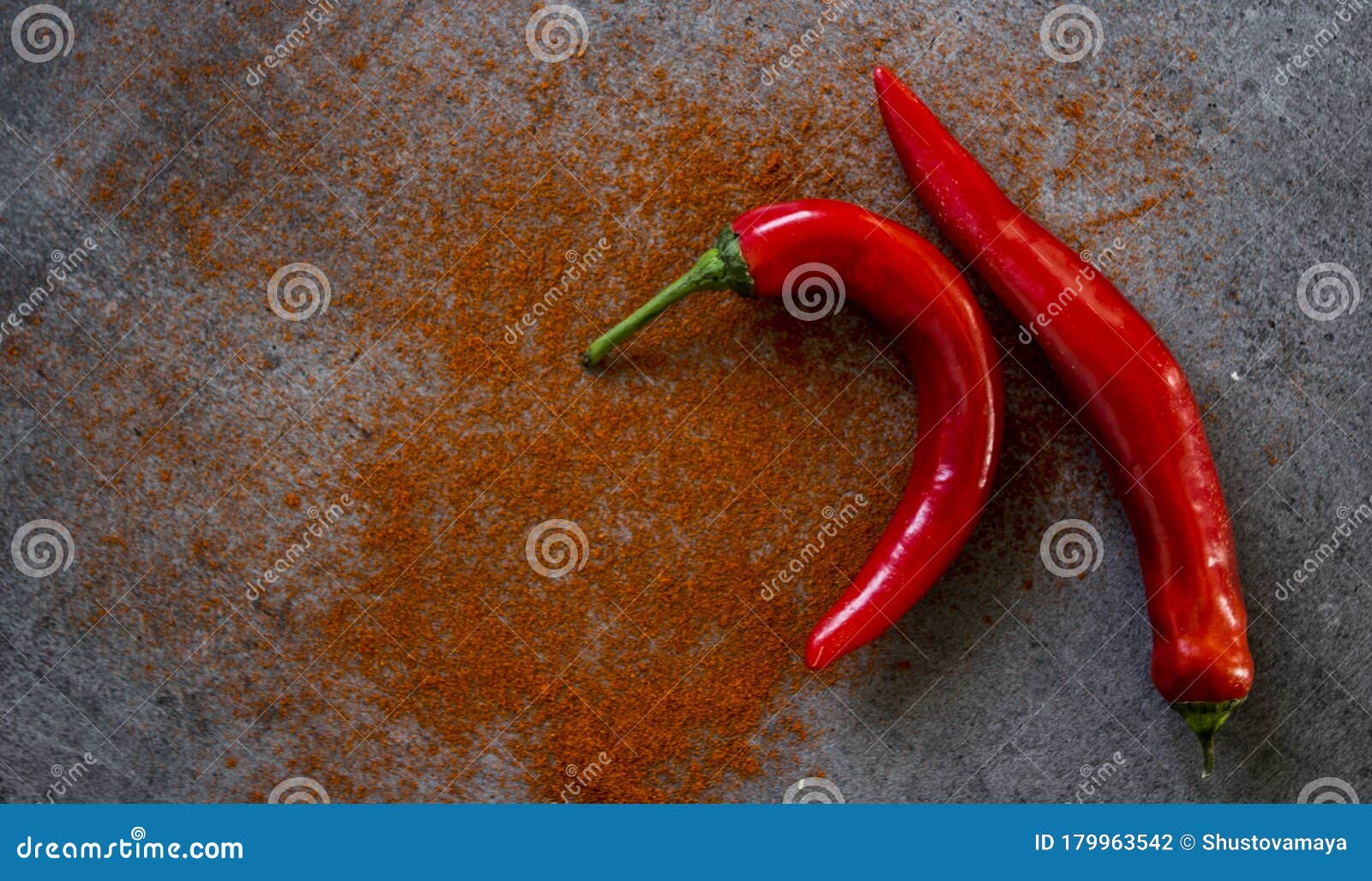 red pepper and paprika powder on a table flat lay