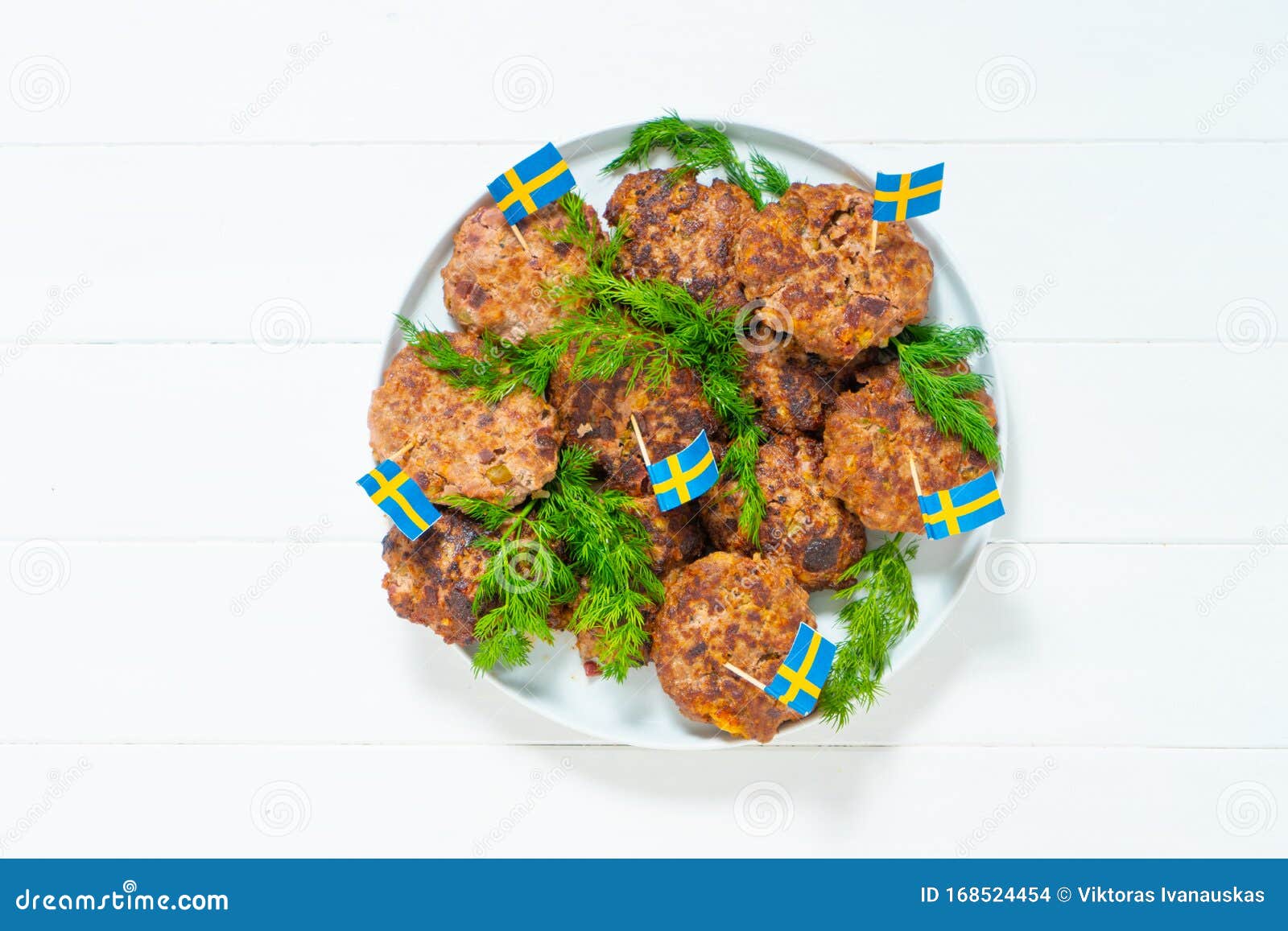 ingredients for a traditional swedish dish beef lindstrom. in the plate with dill. swedish flag. swedish cuisine. scandinavian