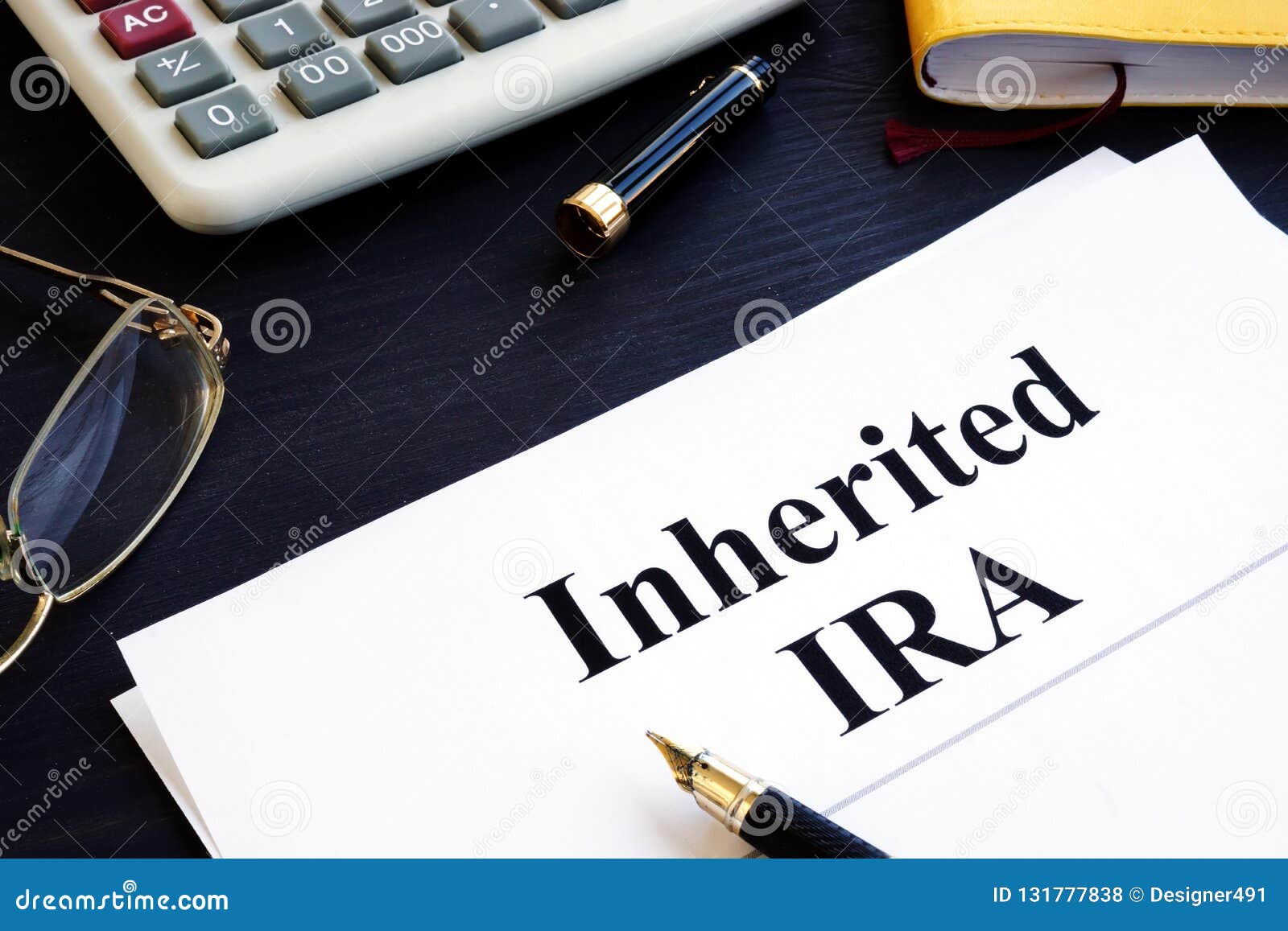 inherited ira documents on a table. retirement plan