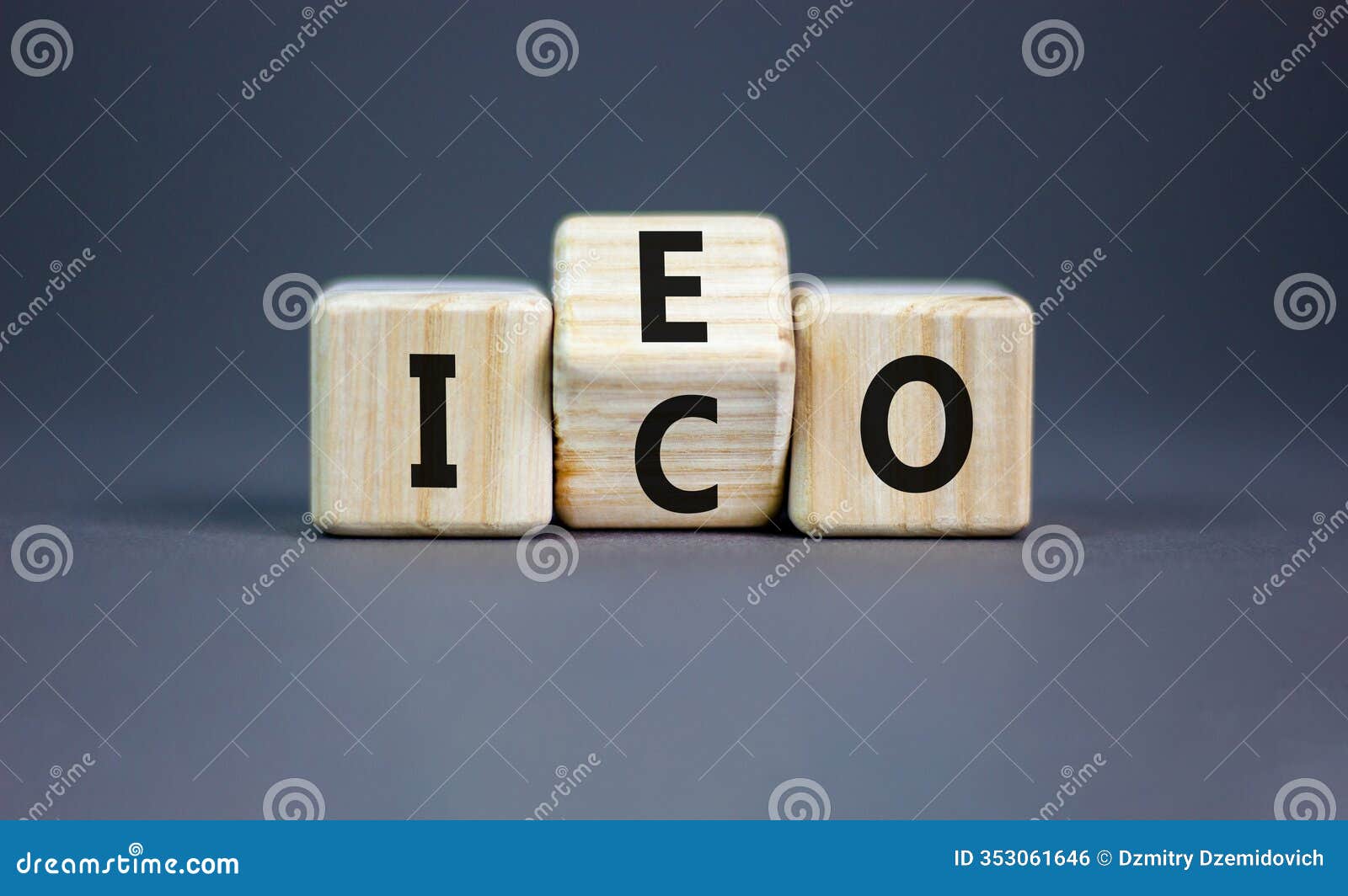 initial coin or exchange offering . concept words abbreviation ico or ieo on wooden block. beautiful grey table grey