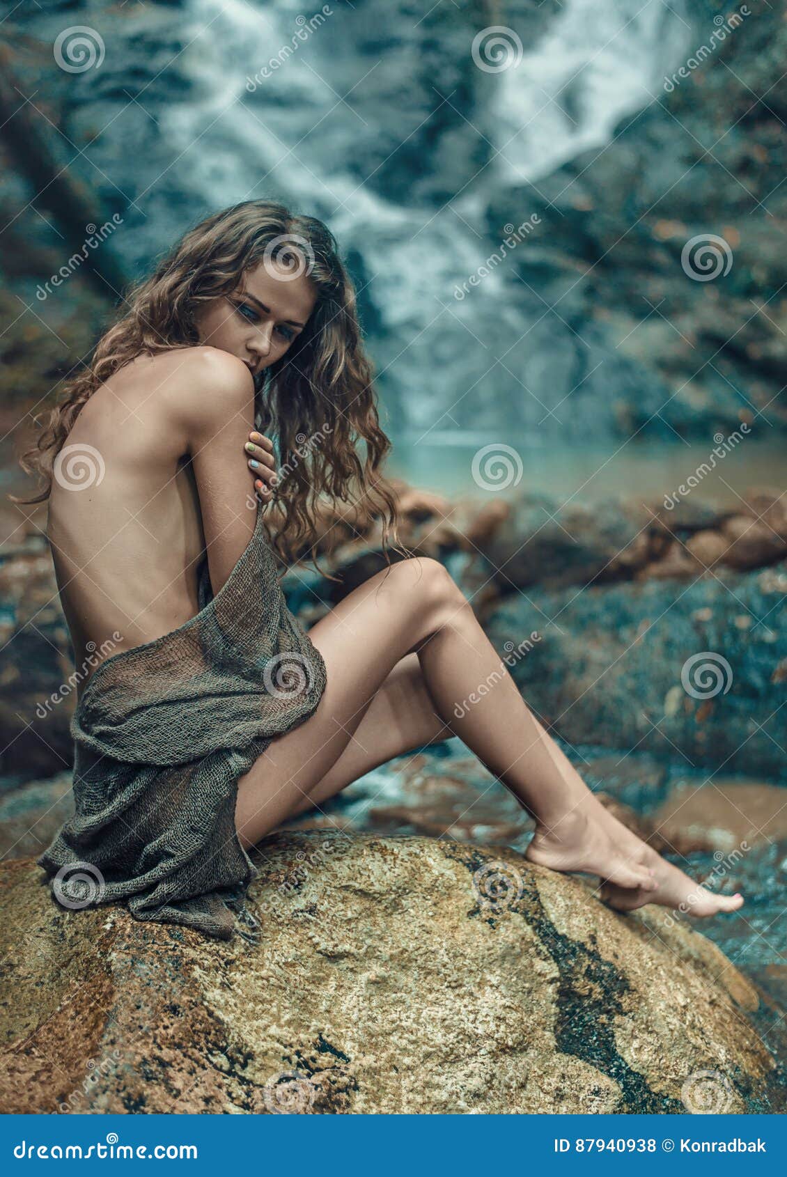 innocent lady resting on the sharp rock