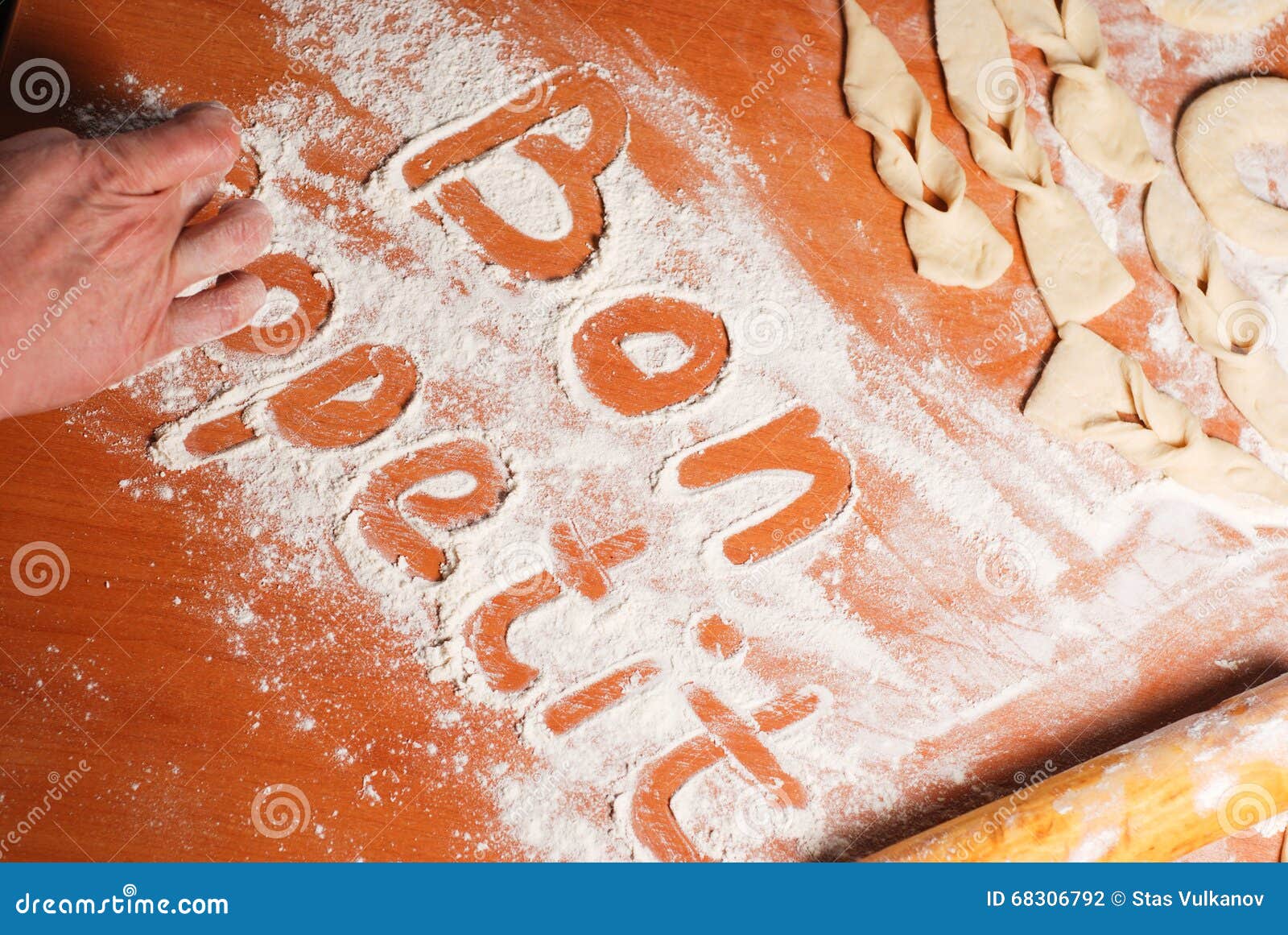 The Inscription Bon Appetit on the Table with Flour Stock Photo Image