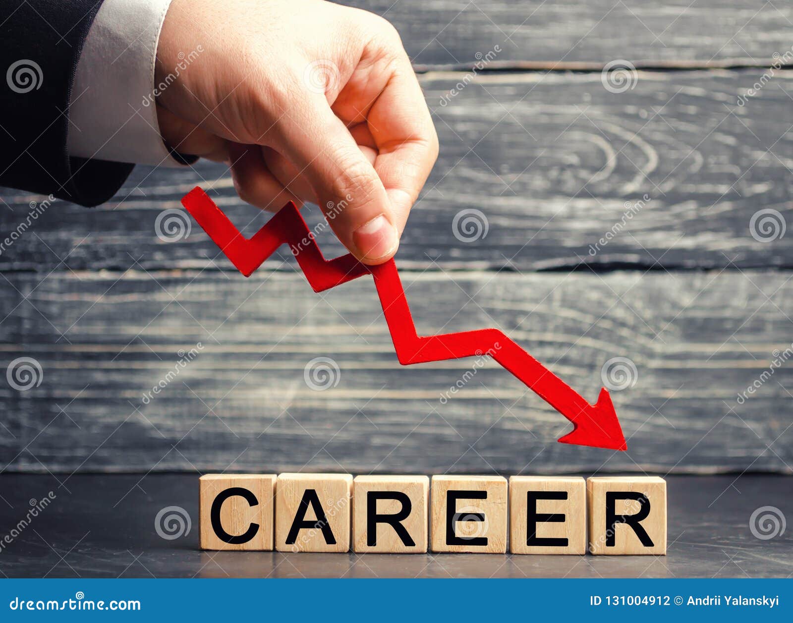 the inscription `career` and the red arrow down. career down. a demotion, a career crisis. lowering the standard of living. cutbac