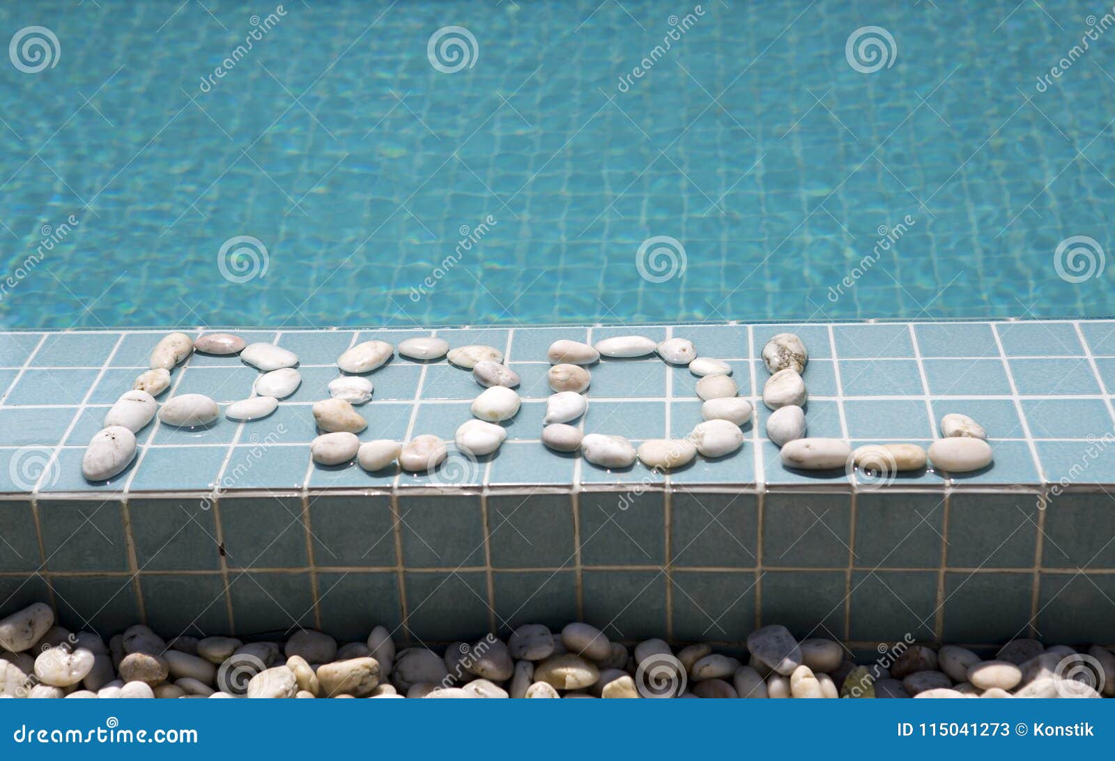 The Inscription `pool` is Laid Out by Pebble on a Pool Side Stock Image