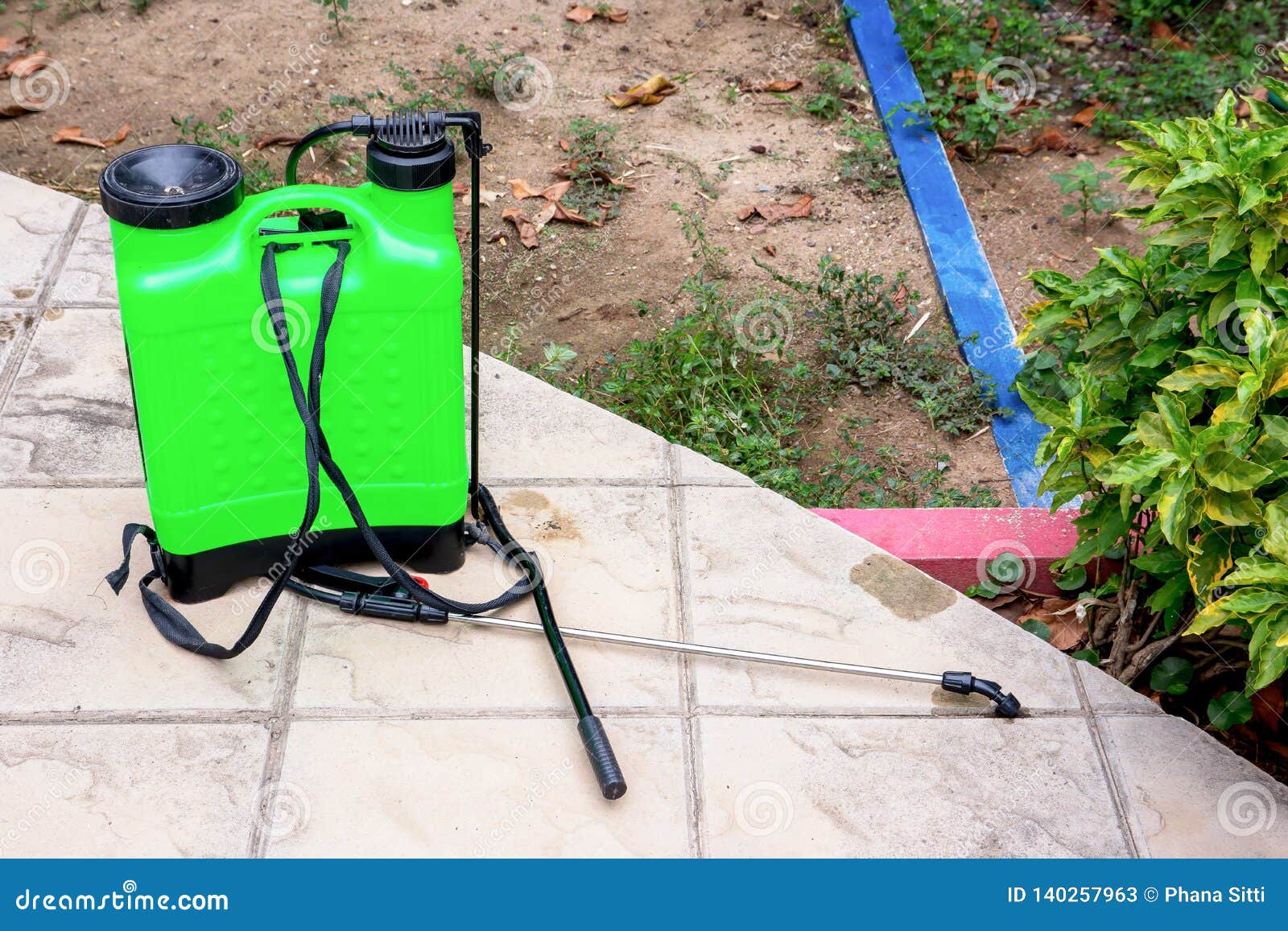 Insecticide Sprayer Isolated on the Floor in the Garden Stock Image Image of canister