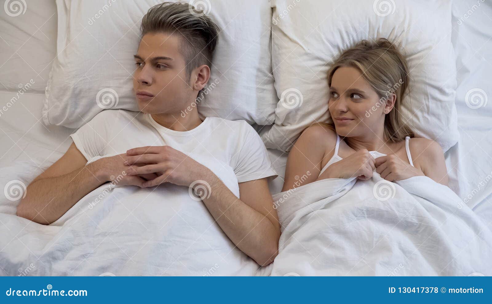 Insecure Young Man Feeling Scared before First Sex with Girlfriend, Panic Stock Photo image