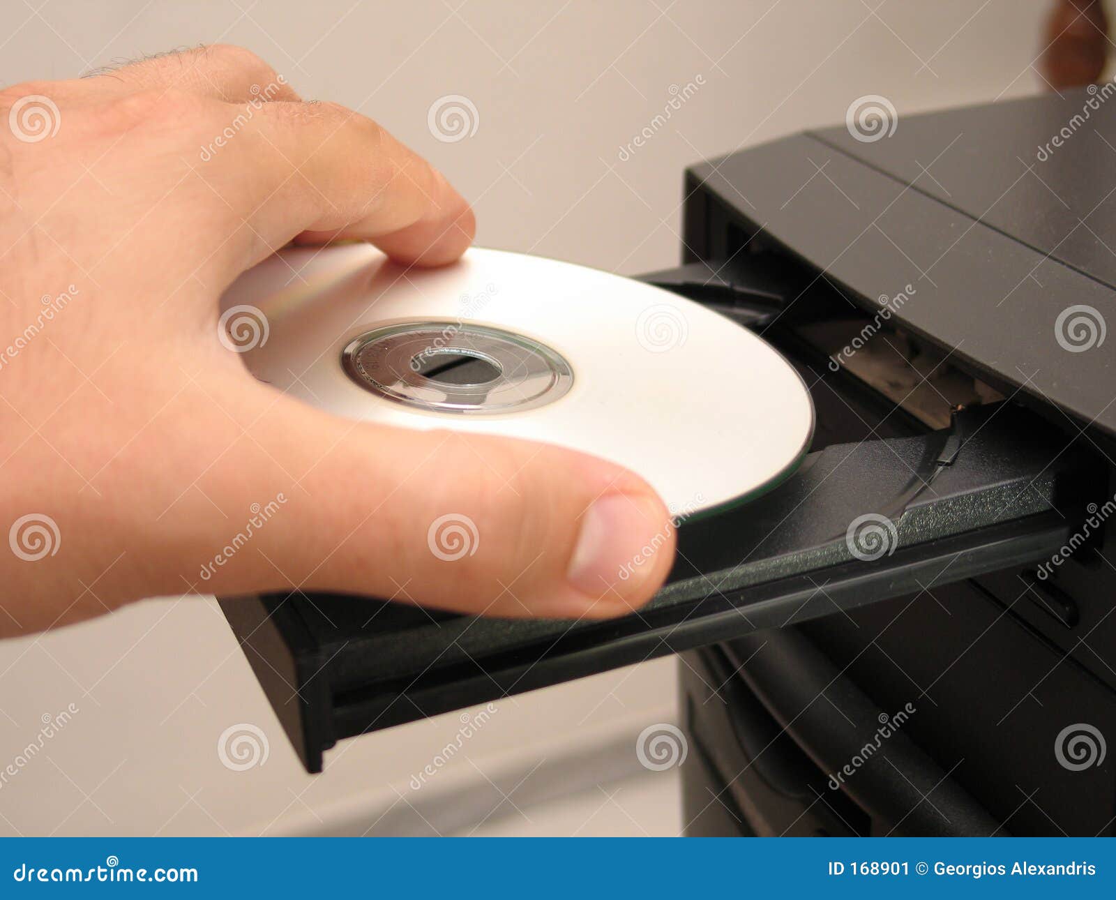 Inserting the cd stock image image 168901