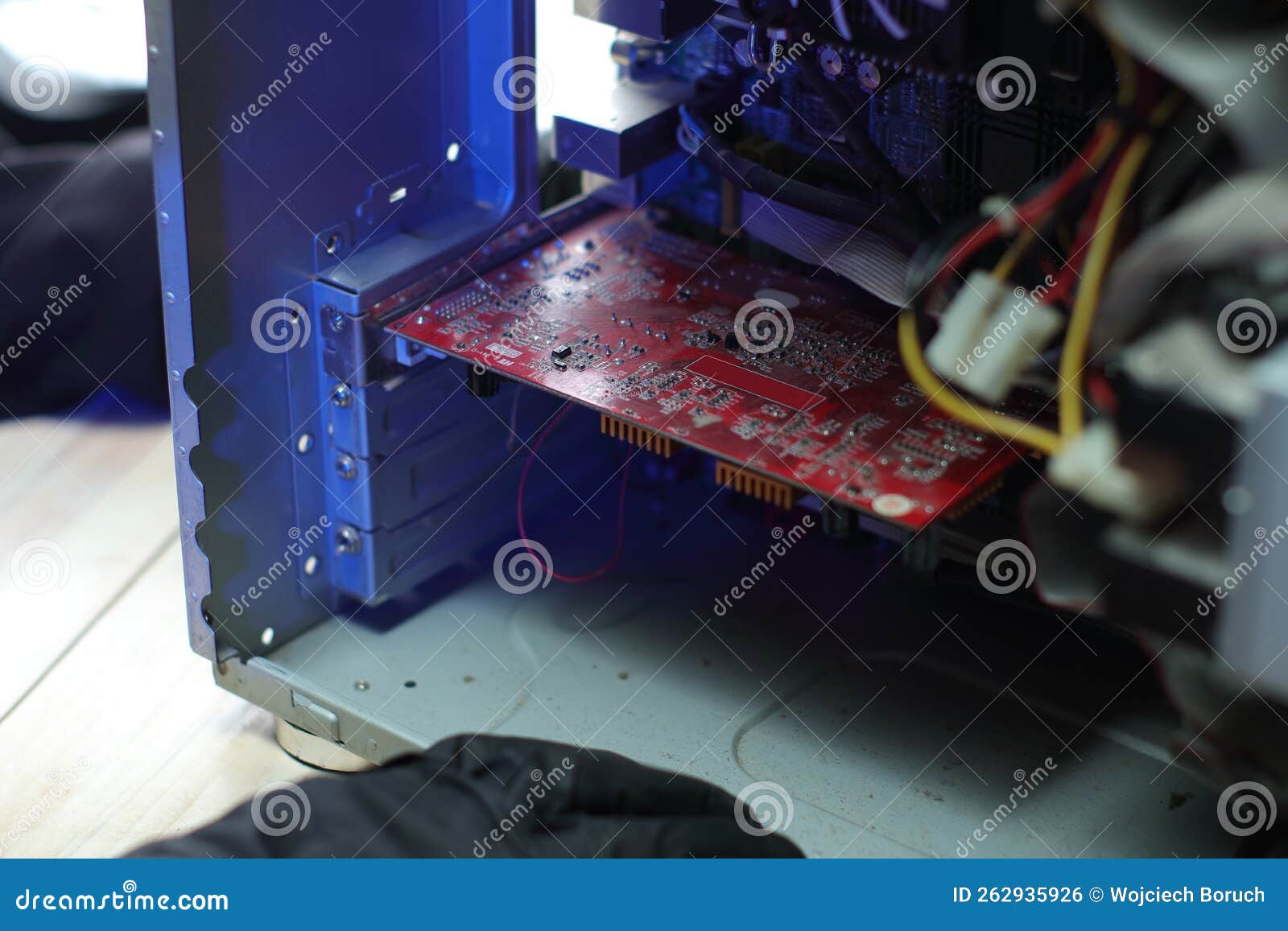 Inserting an Old Graphics Card into a Computer Stock Photo Image of