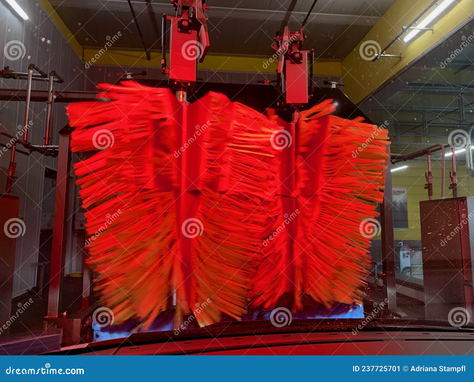 Inside Automatic Conveyorized Tunnel Car Wash. View from Inside Car