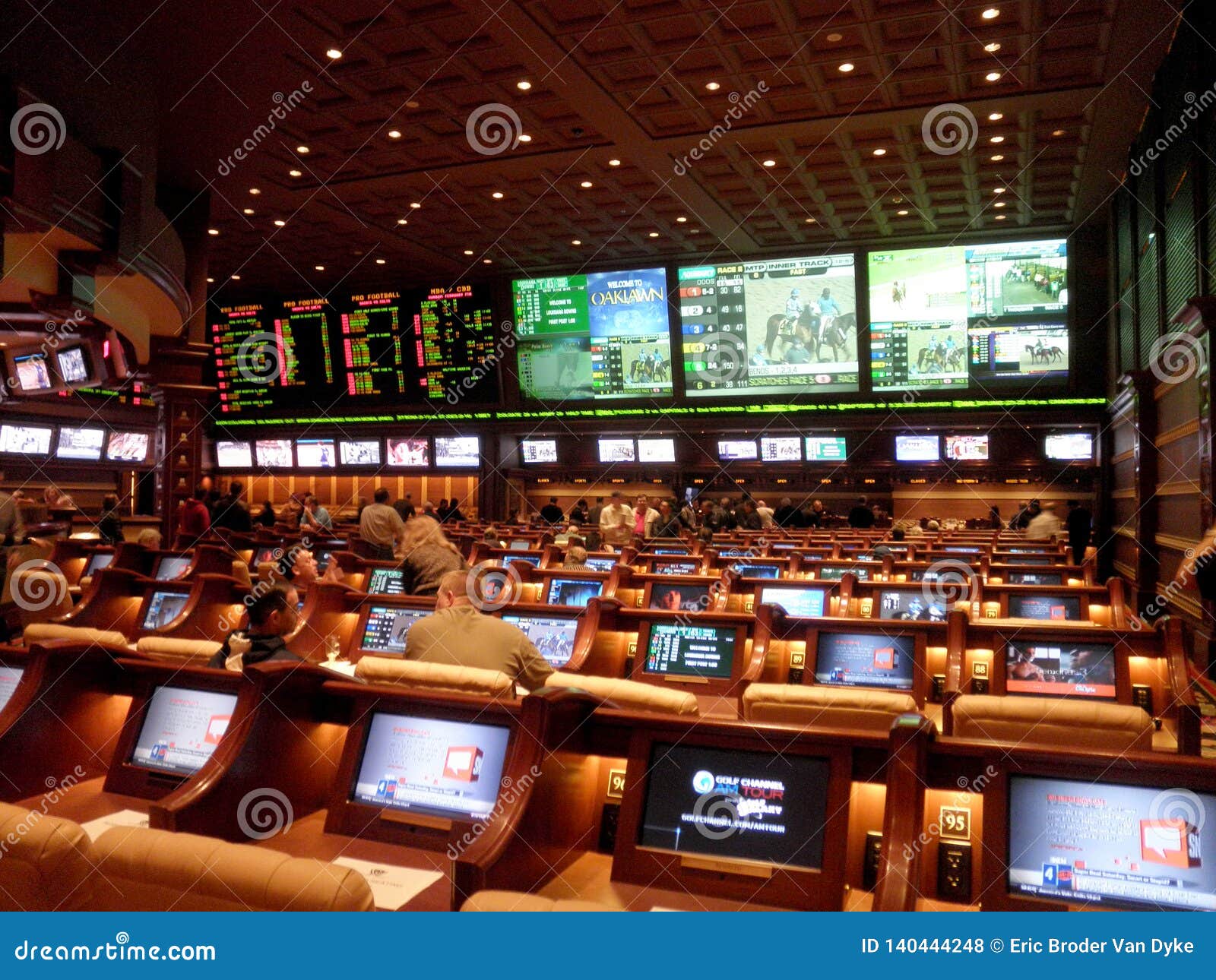 Las Vegas - February 7, 2010: Inside Wynn Sportsbook. Featuring plenty of TVs giant, big, or small, that bend around the sportsbook in a somewhat rounded L-shape. It has sports and the horse racing on giant screens betting casino football game money gamble online gambling odds web internet play website poker yellow window home computer page board passion bowl tech advertising banking royal winner