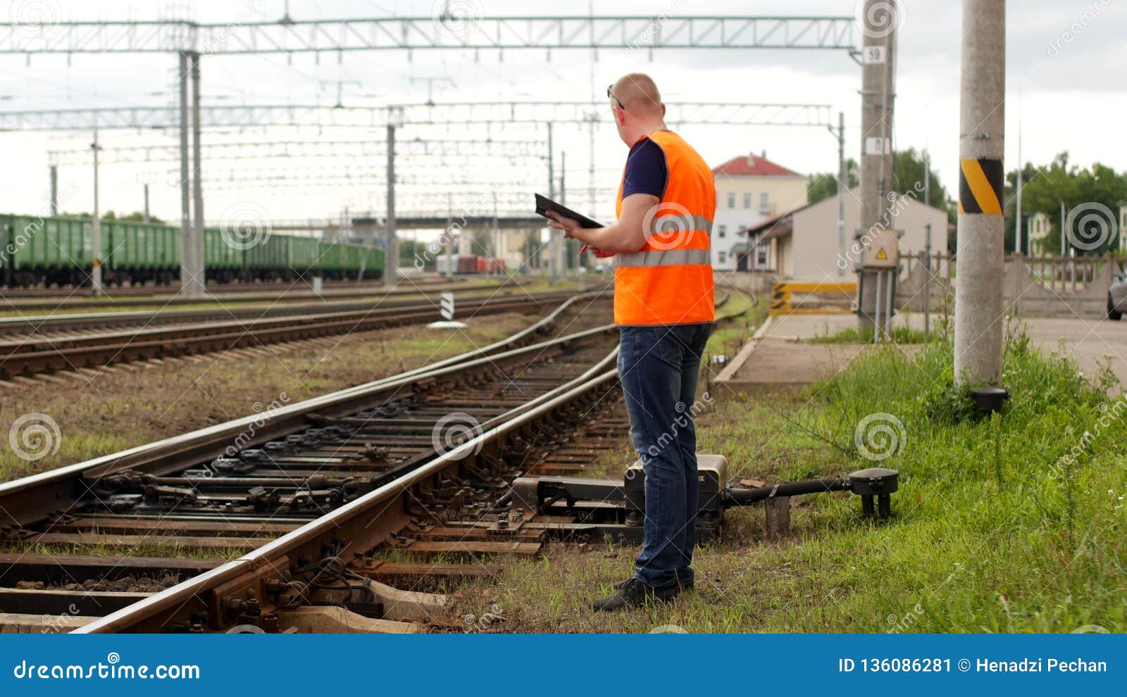 Inspector Inspects Checks the Automatic Switch Mechanism on the Railway