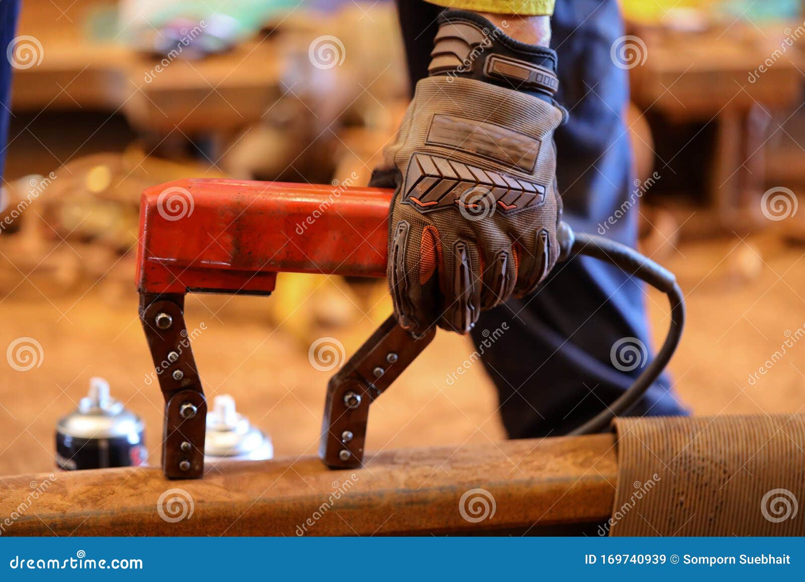 inspector wearing c5 hand safety glove protection holding conducting magnetic particle testing