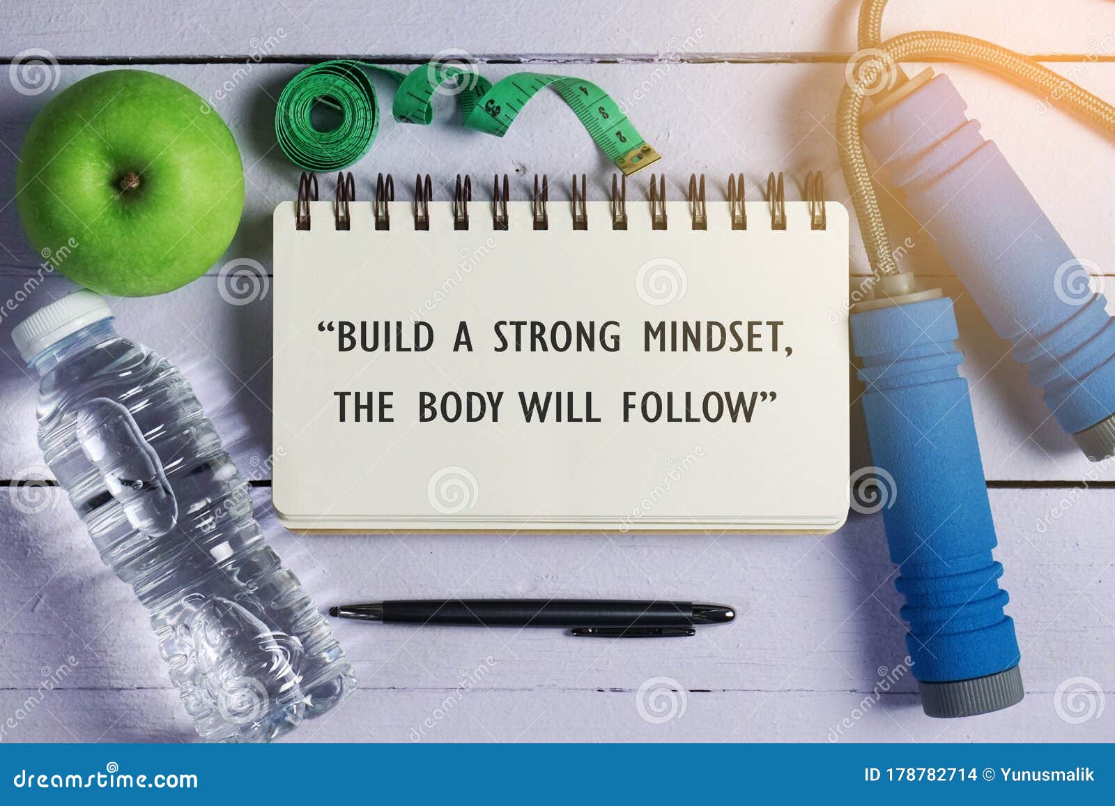 inspirational motivating quote on notebook. build a strong mindset, the body will follow.