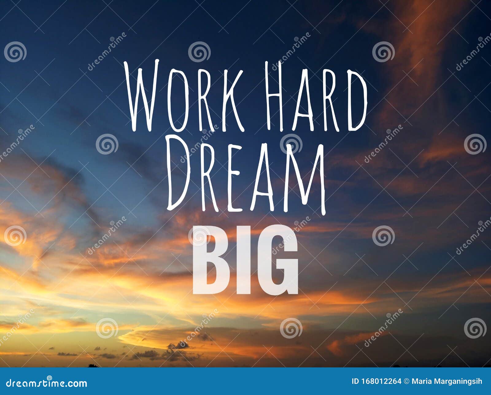 inspirational motivational quote - work hard, dream big. with blurry background of dramatic and colorful sky clouds view.