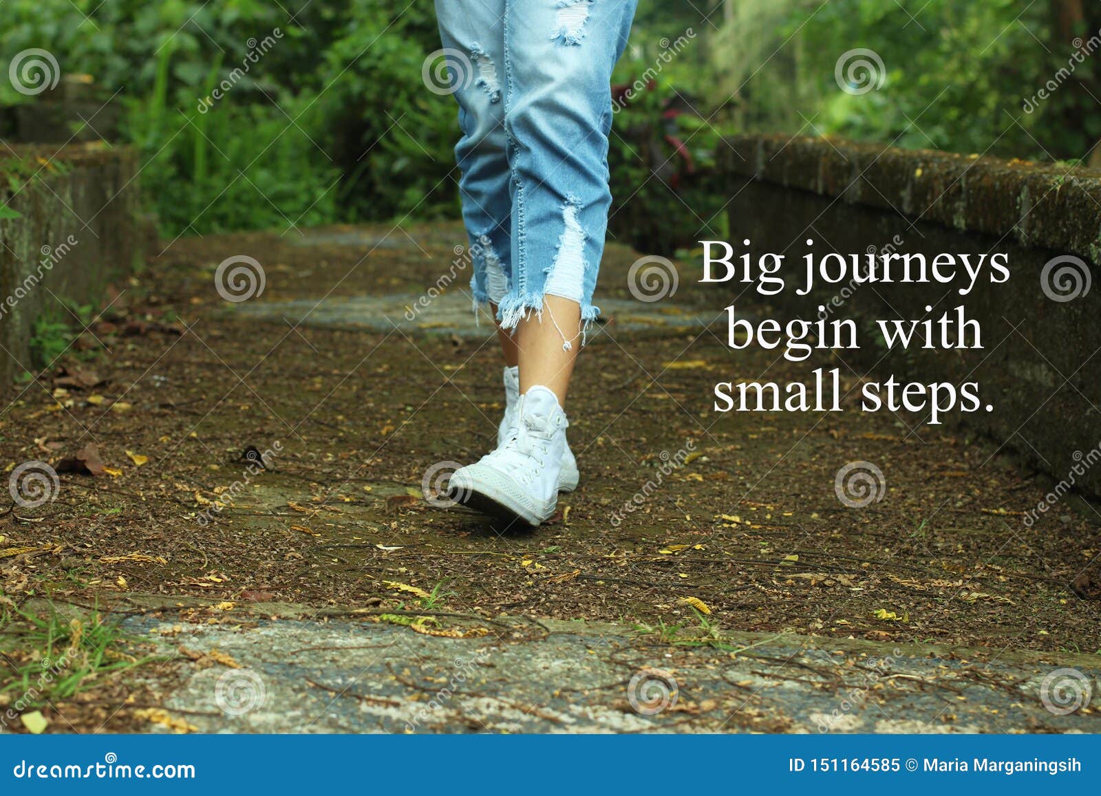 inspirational quote- big journeys begin with small steps. with feet of young woman walking surrounding with fresh green nature