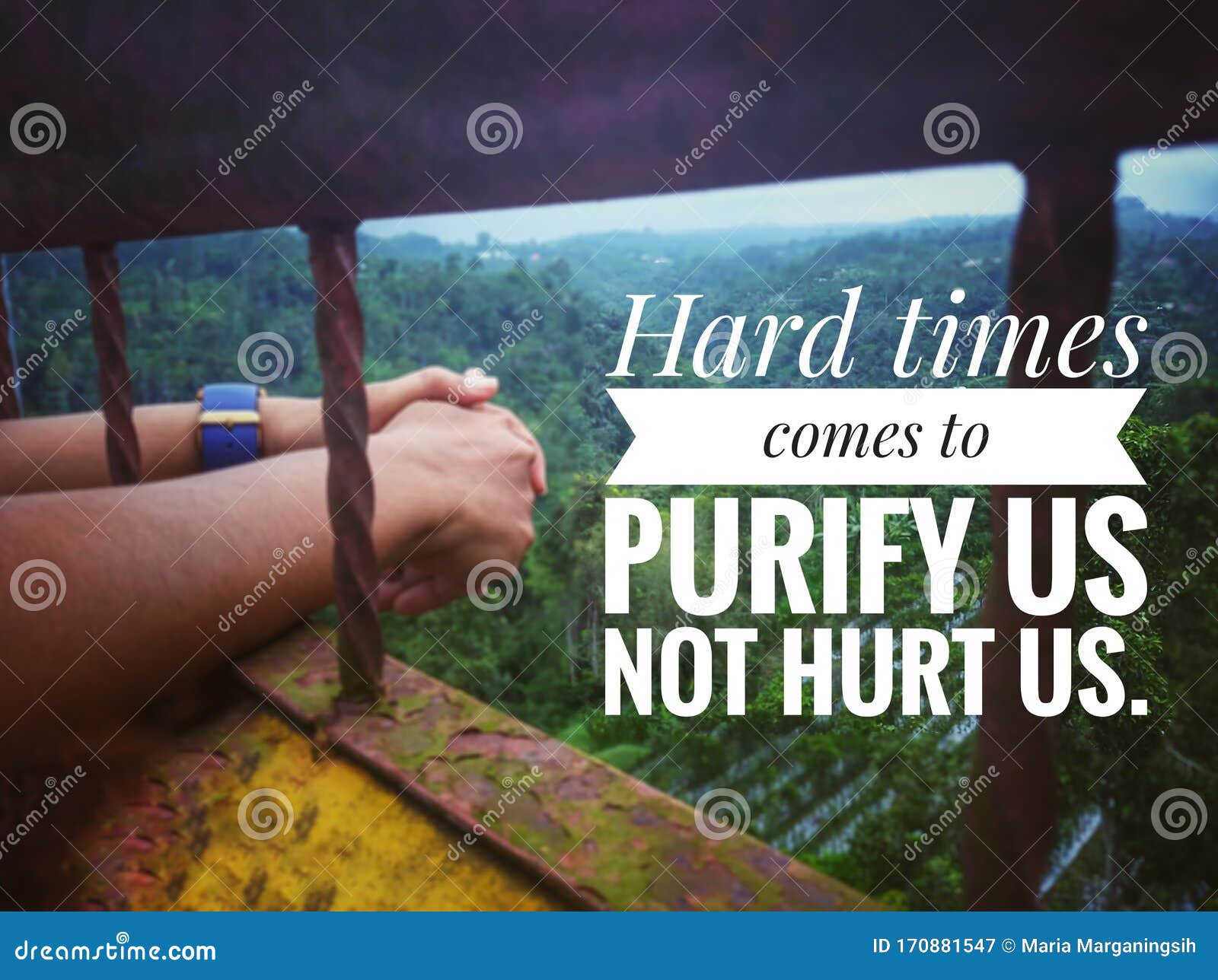 inspirational quote - hard times comes to purify us not hurt us. with blurry background of imprisoned hands and fresh green nature
