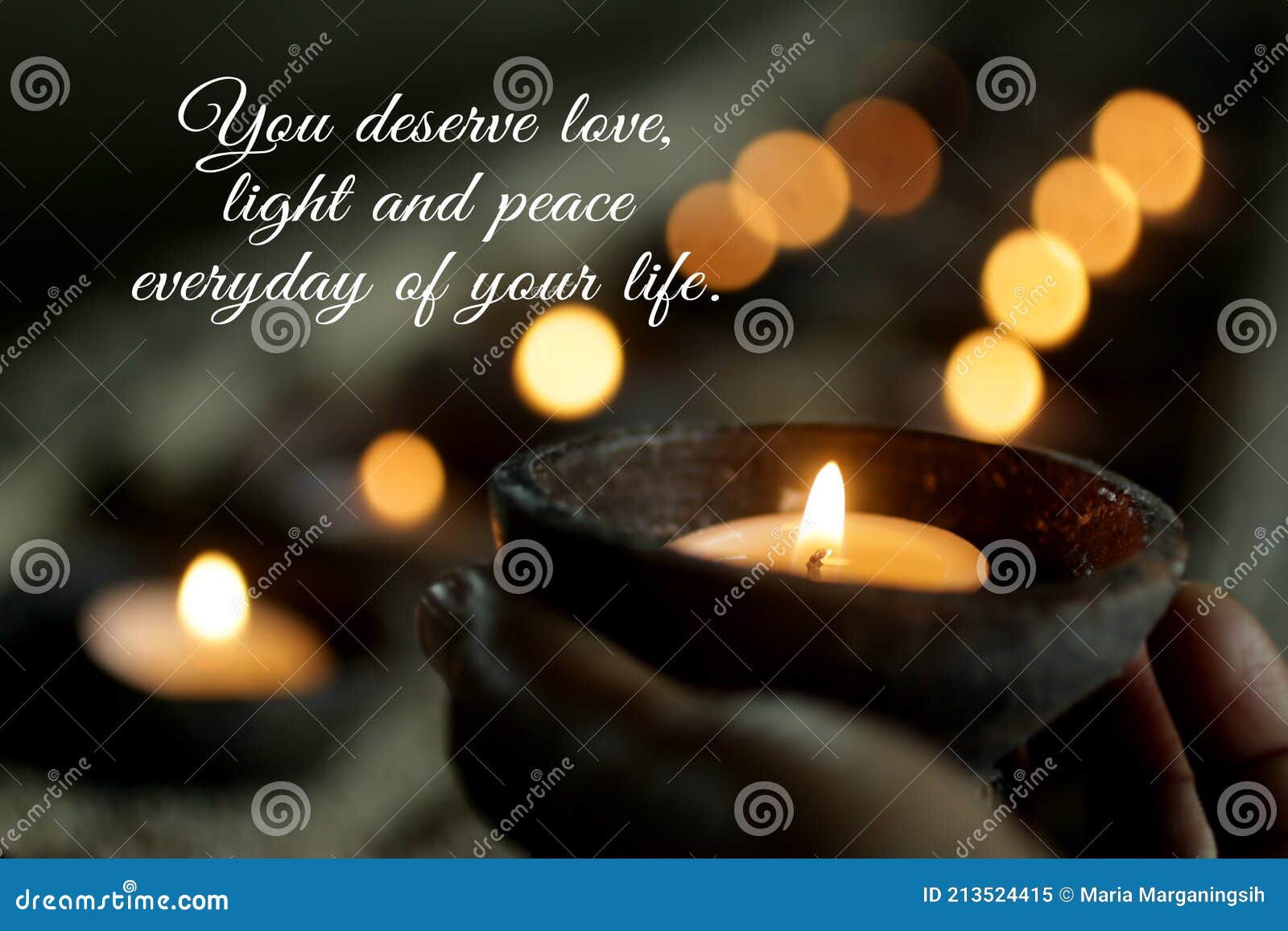 inspirational quote - you deserve love, light, peace everyday of your life. self love care worthy concept with candle in hand.