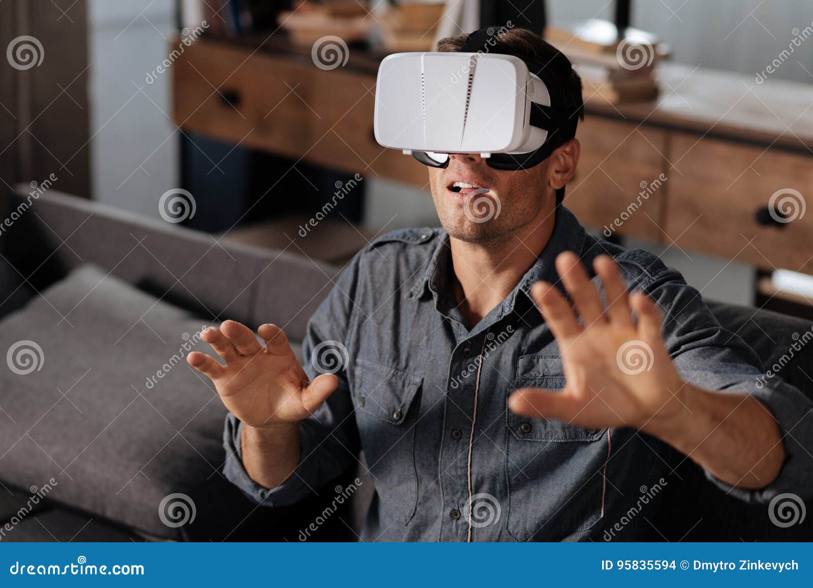Inspired Guy Seeing Another Dimensions through Technology Stock Photo
