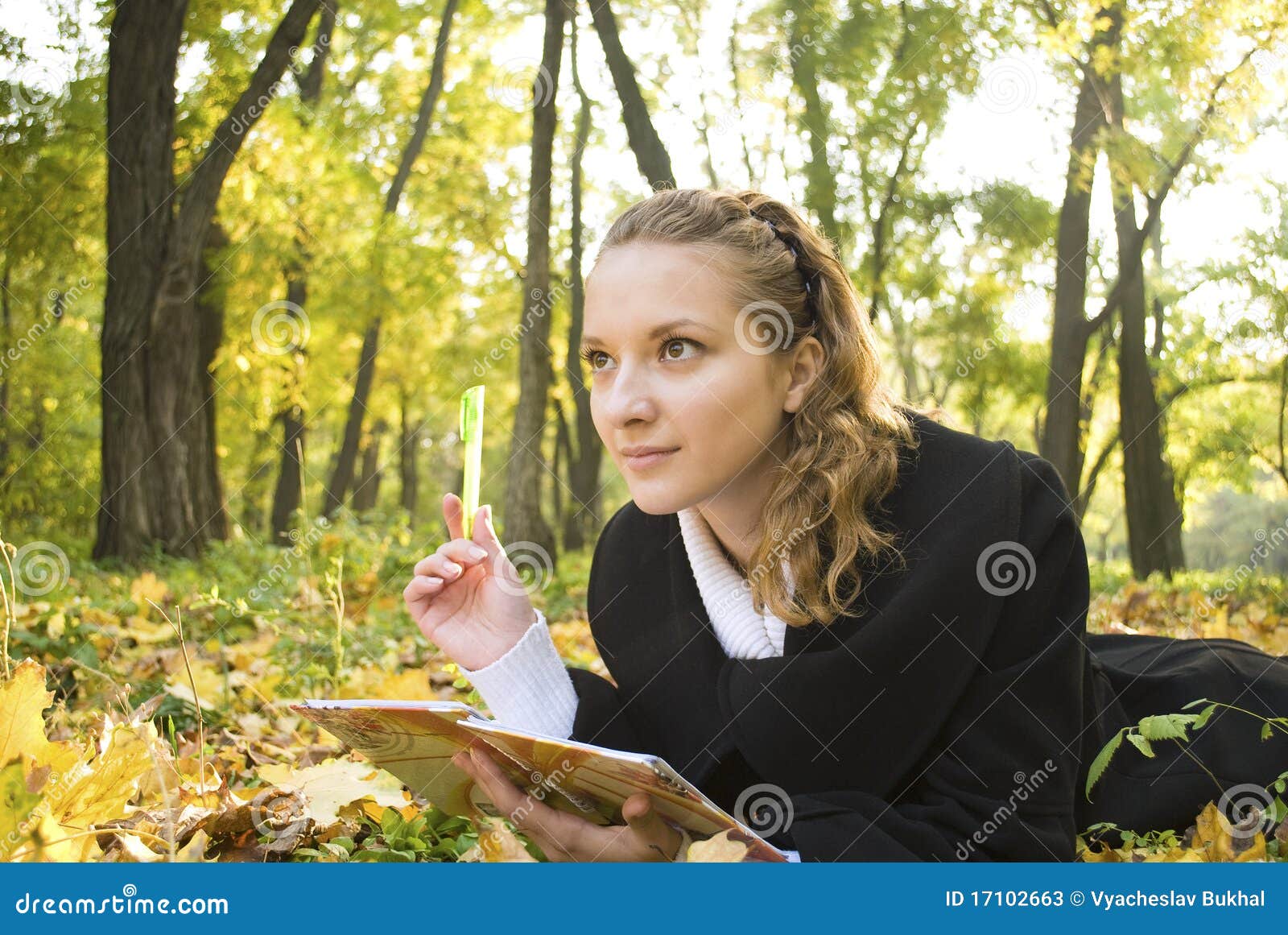 inspired teenager girl in autumn park
