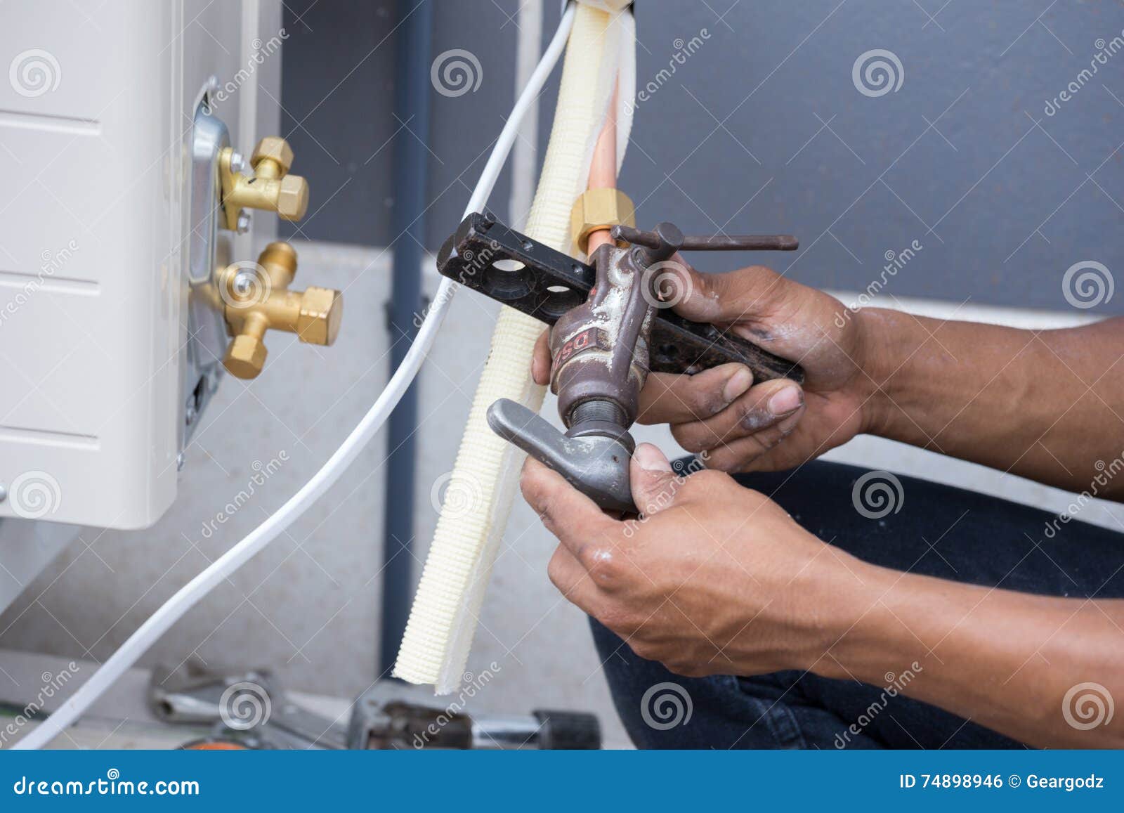 Installation of Air Conditioner, Worker Connects Copper Pipe Stock