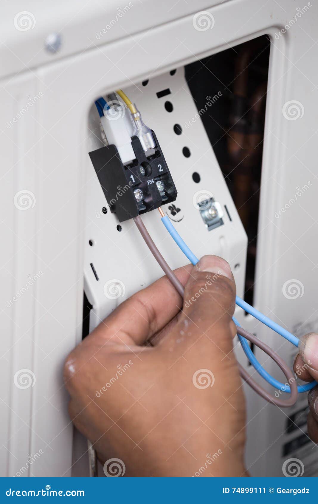 Installation of Air Conditioner, Worker Connects Electric Wires Stock