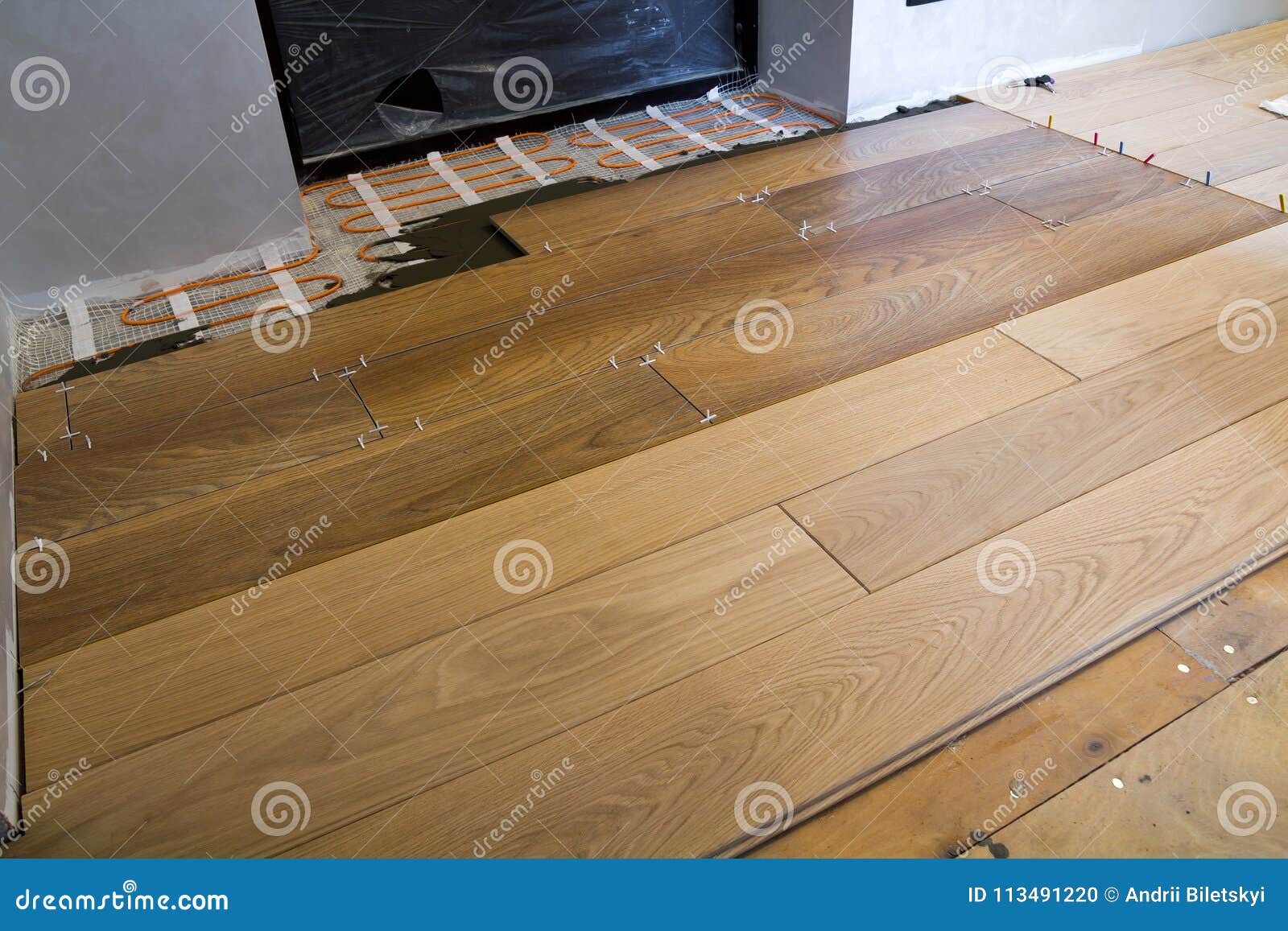 Installation of Ceramic Tiles and Heating Elements in Warm Tile Floor
