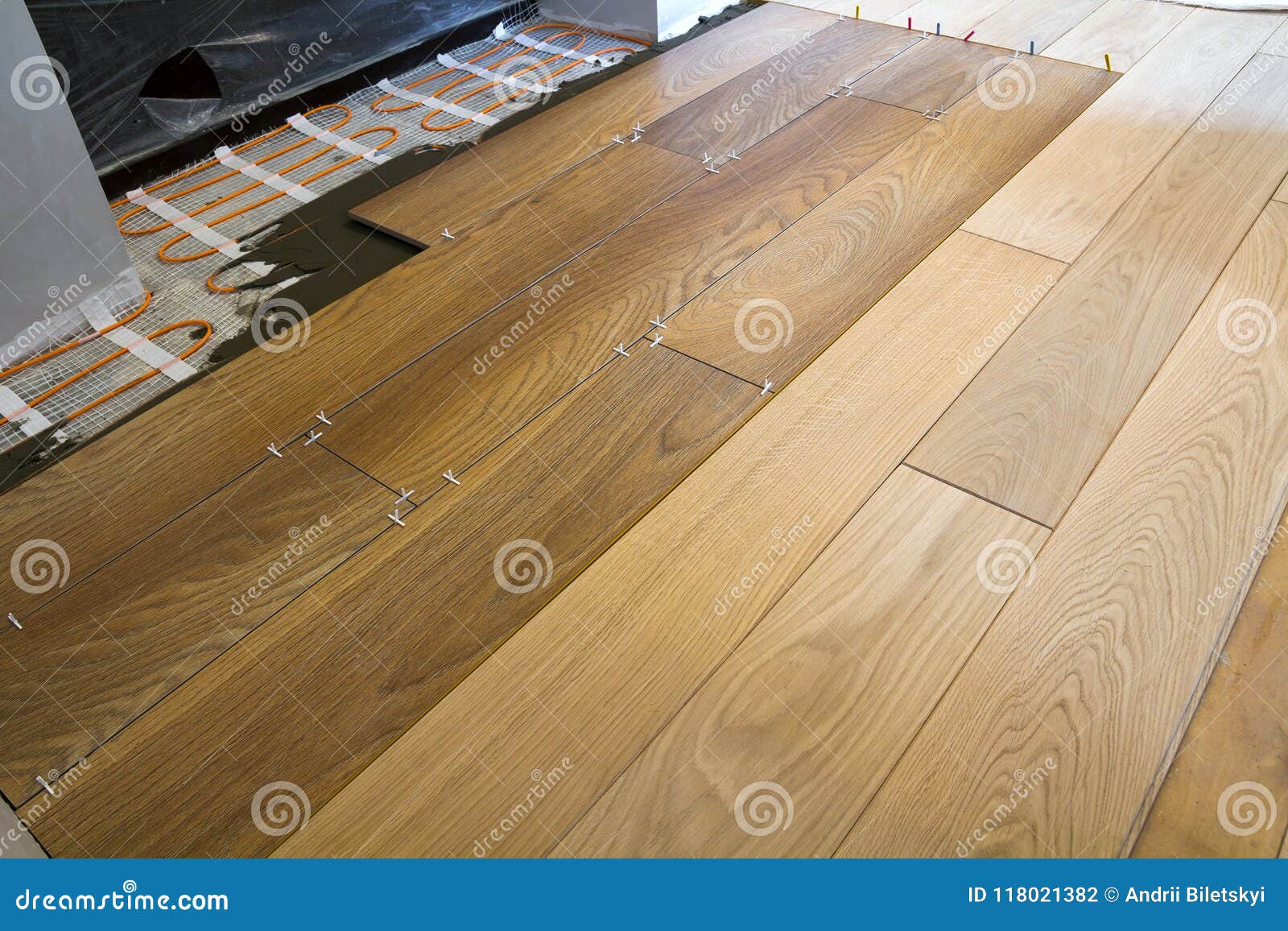Installation of Ceramic Tiles and Heating Elements in Warm Tile Floor