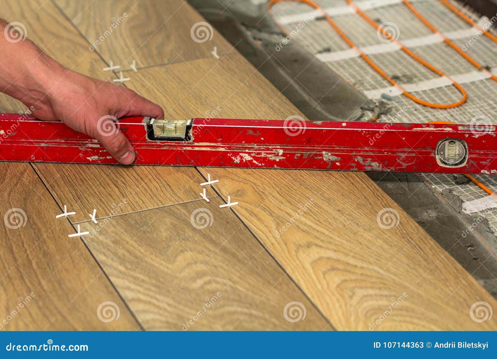 Installation of Ceramic Tiles and Heating Elements in Warm Tile Stock