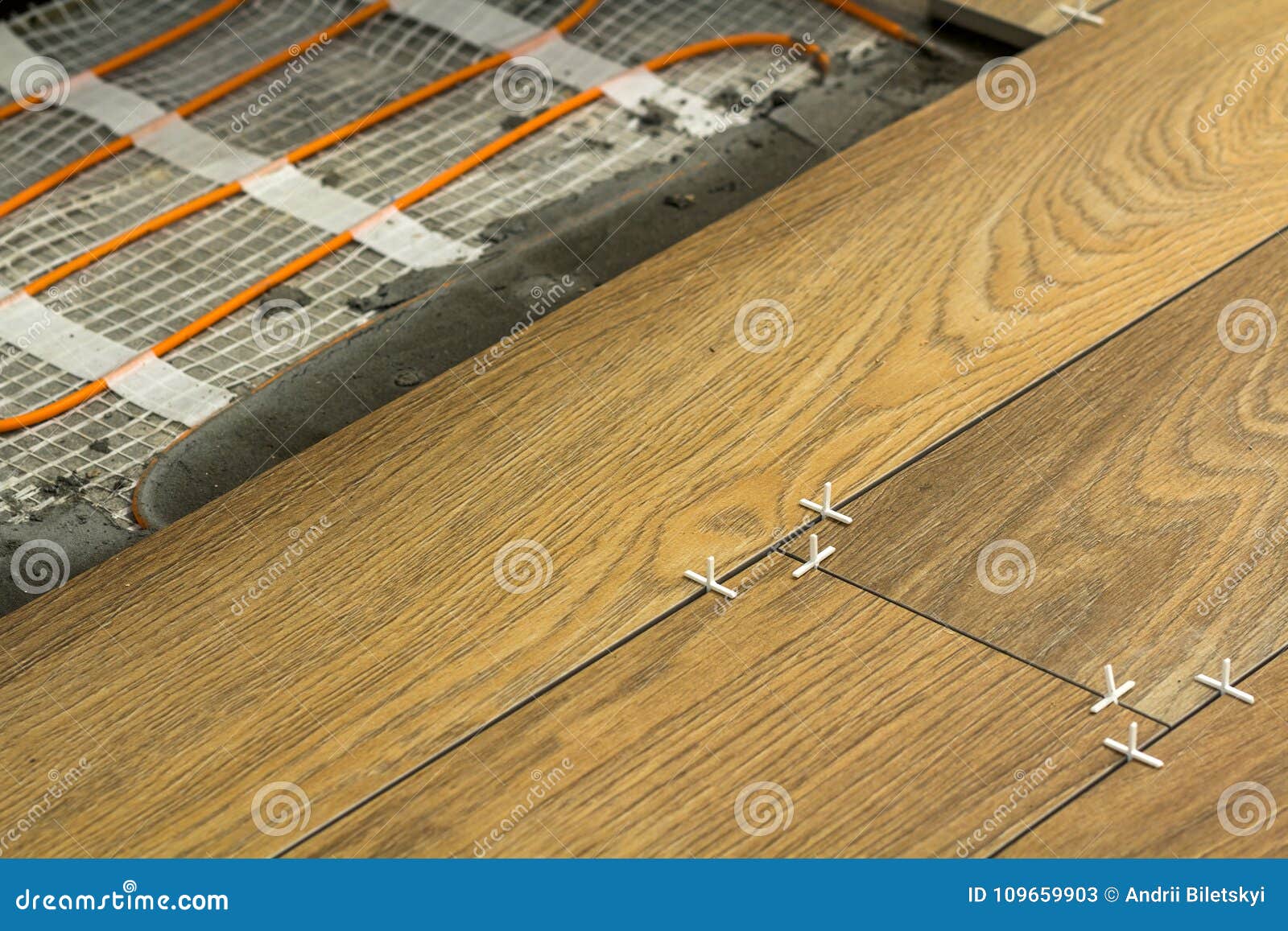 Installation of Ceramic Tiles and Heating Elements in Warm Tile Stock