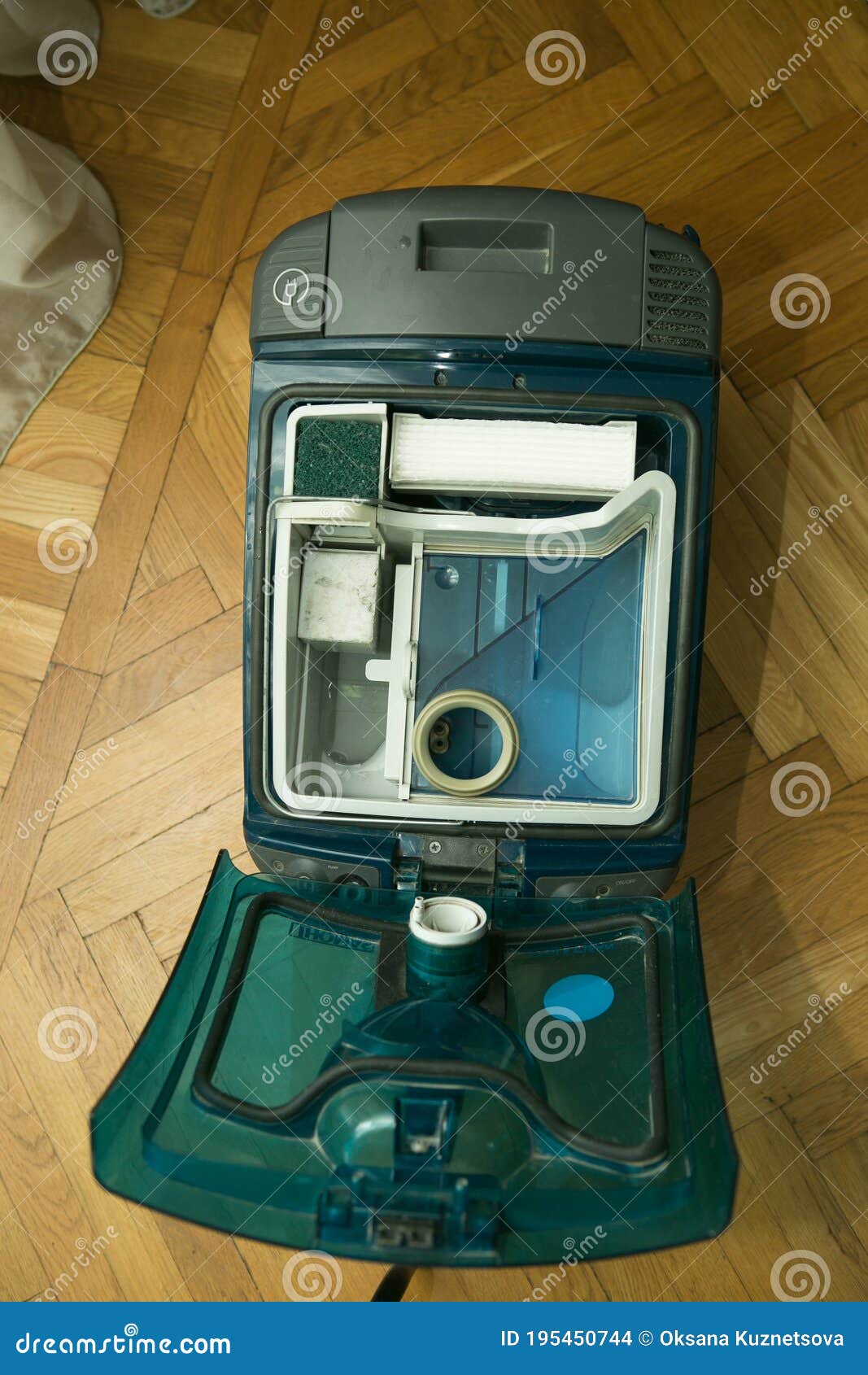 The Process of Cleaning a Room with a Vacuum Cleaner with an Aquafilter. Installation of a Clean