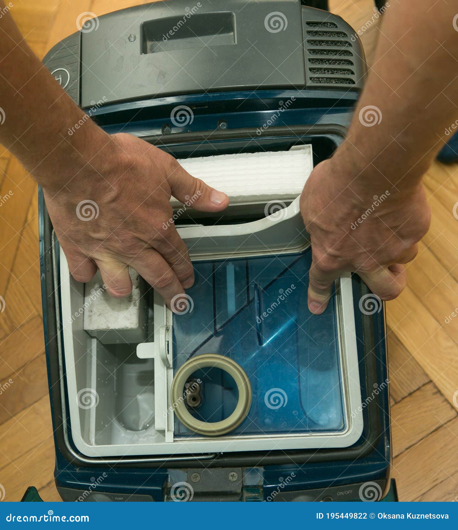 The Process of Cleaning a Room with a Vacuum Cleaner with an Aquafilter. Installation of a Clean