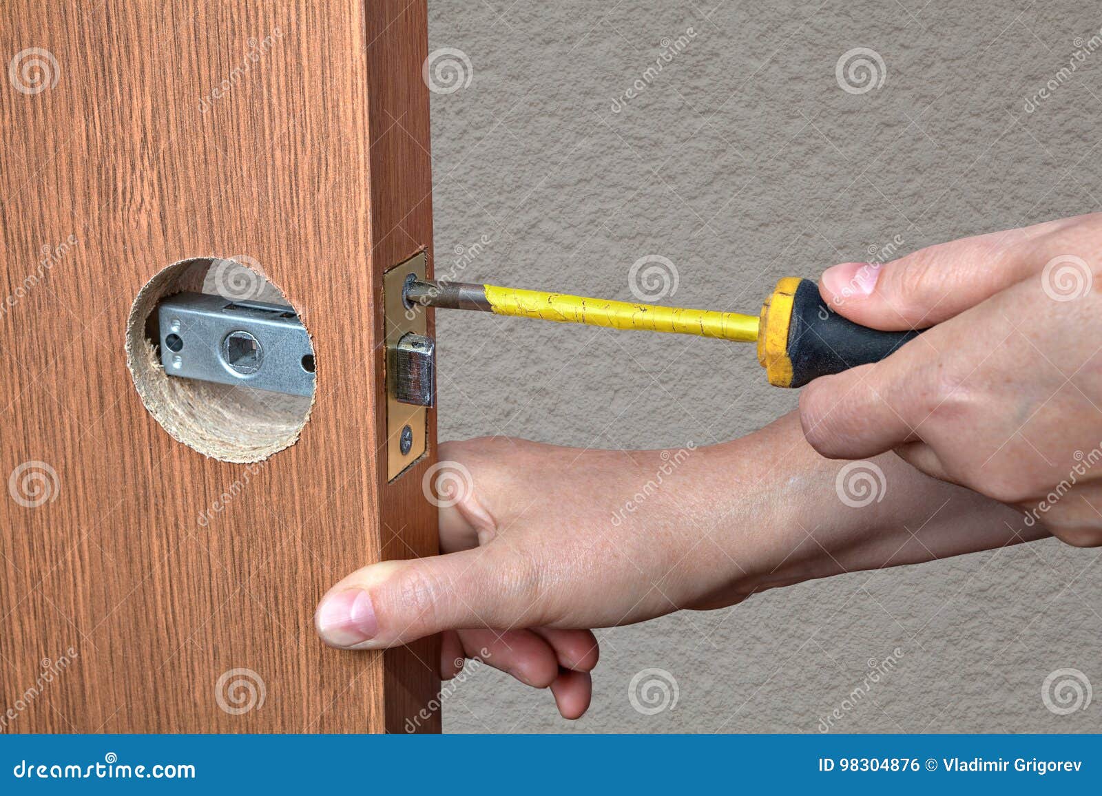 Installation Of The Door Lock A Locksmith Hand Close Up