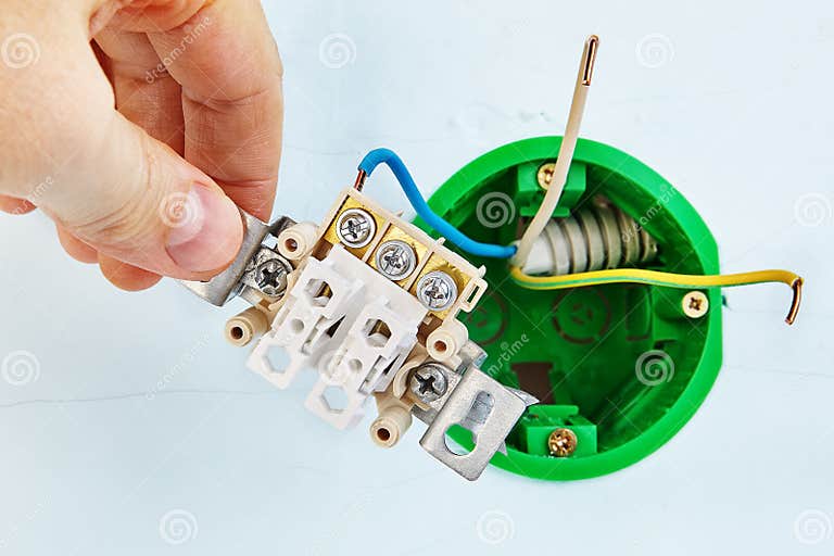 Installation of Electric Light Switch in Drywall Wall Stock Image
