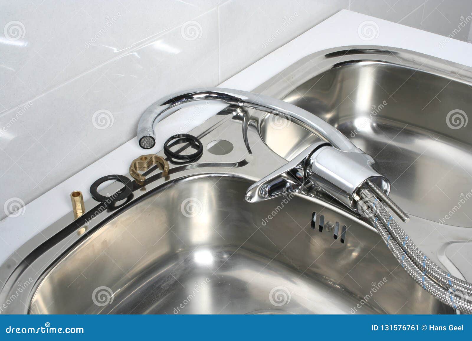 Installation Of A Faucet In A Kitchen Sink Stock Image